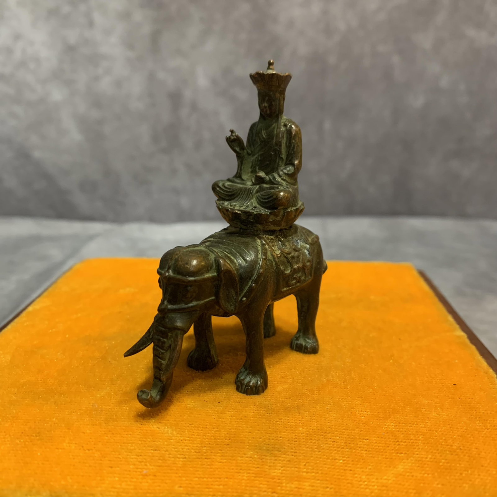 A FINE BRONZE BUDDHA STATUE SEATED ON AN ELEPHANT: 20th Century; Long: 2.2 inch; Width: 1.0 inch; High: 3.1 inch