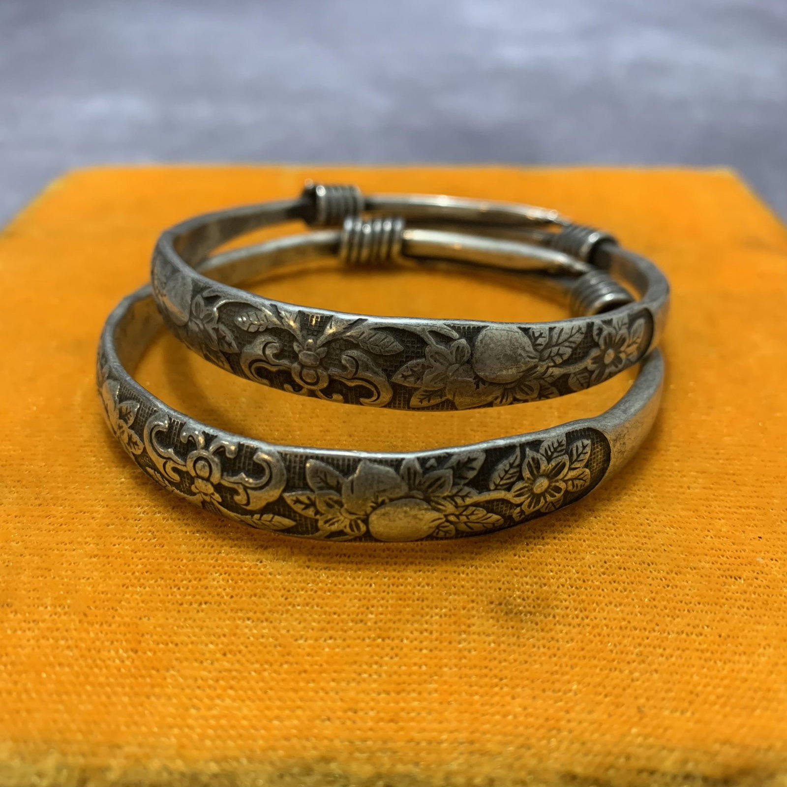 A PAIR OF WHITE BRONZE BANGLES (1 of 4)
