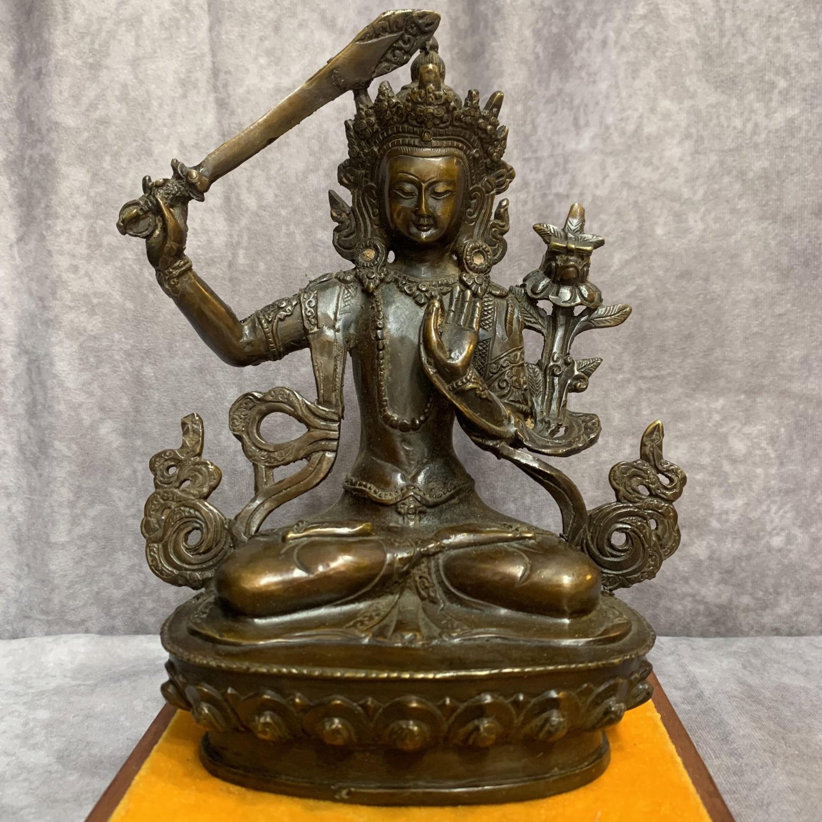 A FINE BRONZE MANJUSHRI BODHISATTVA STATUE: Qing Dynasty, High: 8.0 inch; Width: 6.1 inch; Long: 3.4 inch; Woodbase for picture and display only