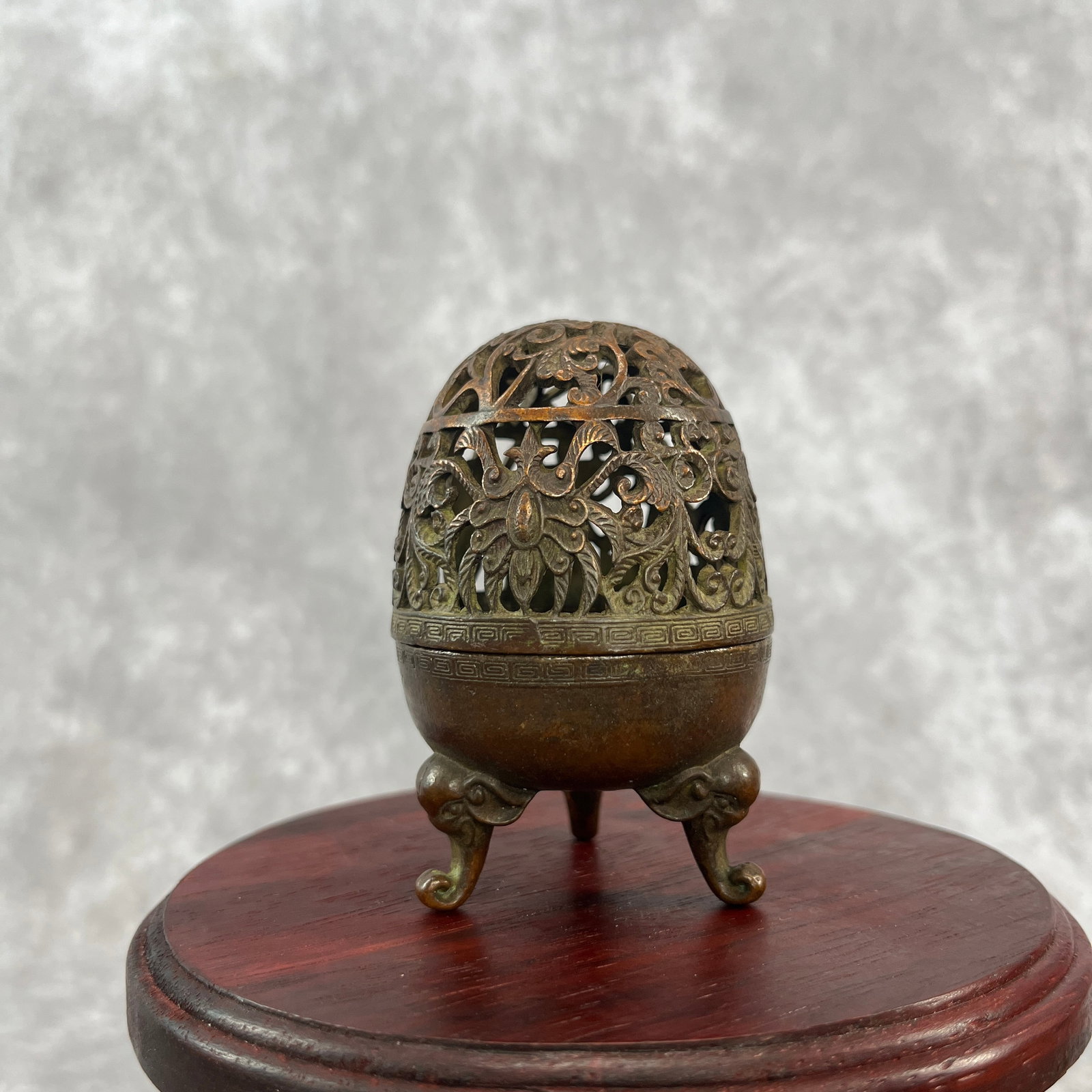 A FINE EGG SHAPED BRONZE INCENSE BURNER: 20th Century; Width:2.1 inch; Heigh: 3.26 inch; Woodbase for picture and display only