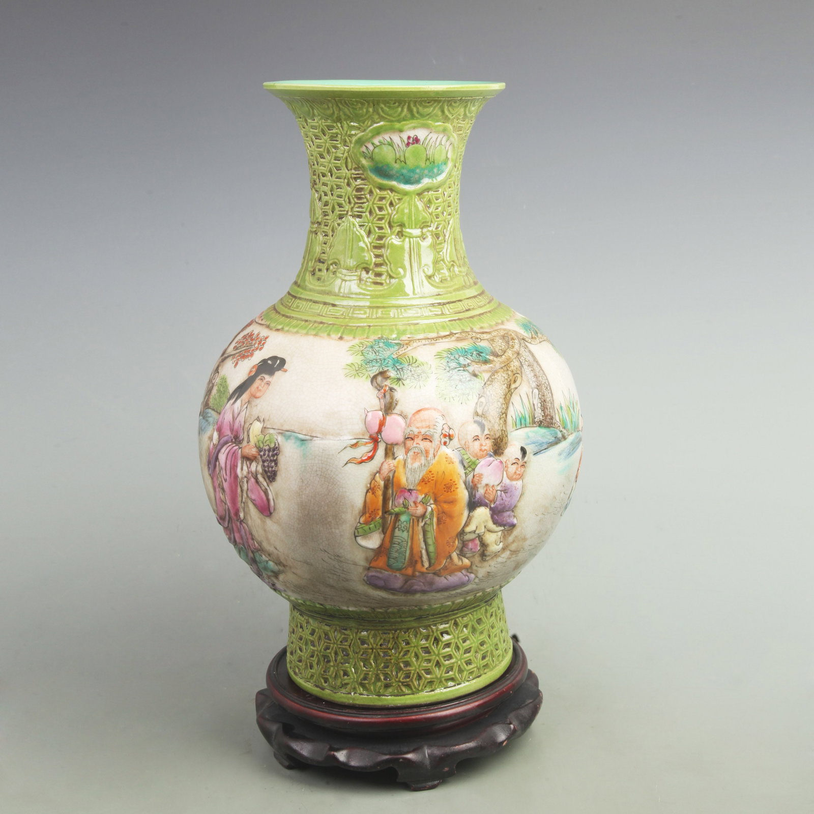 FAMILLE ROSE CARVED VASE WITH BOYS PRESENTING LONGEVITY AND FISH TAIL SHAPE: Qing Dynasty Qian Long Period; High: 14.8 inch; Width: 10 inch; Woodbase for picture and display only