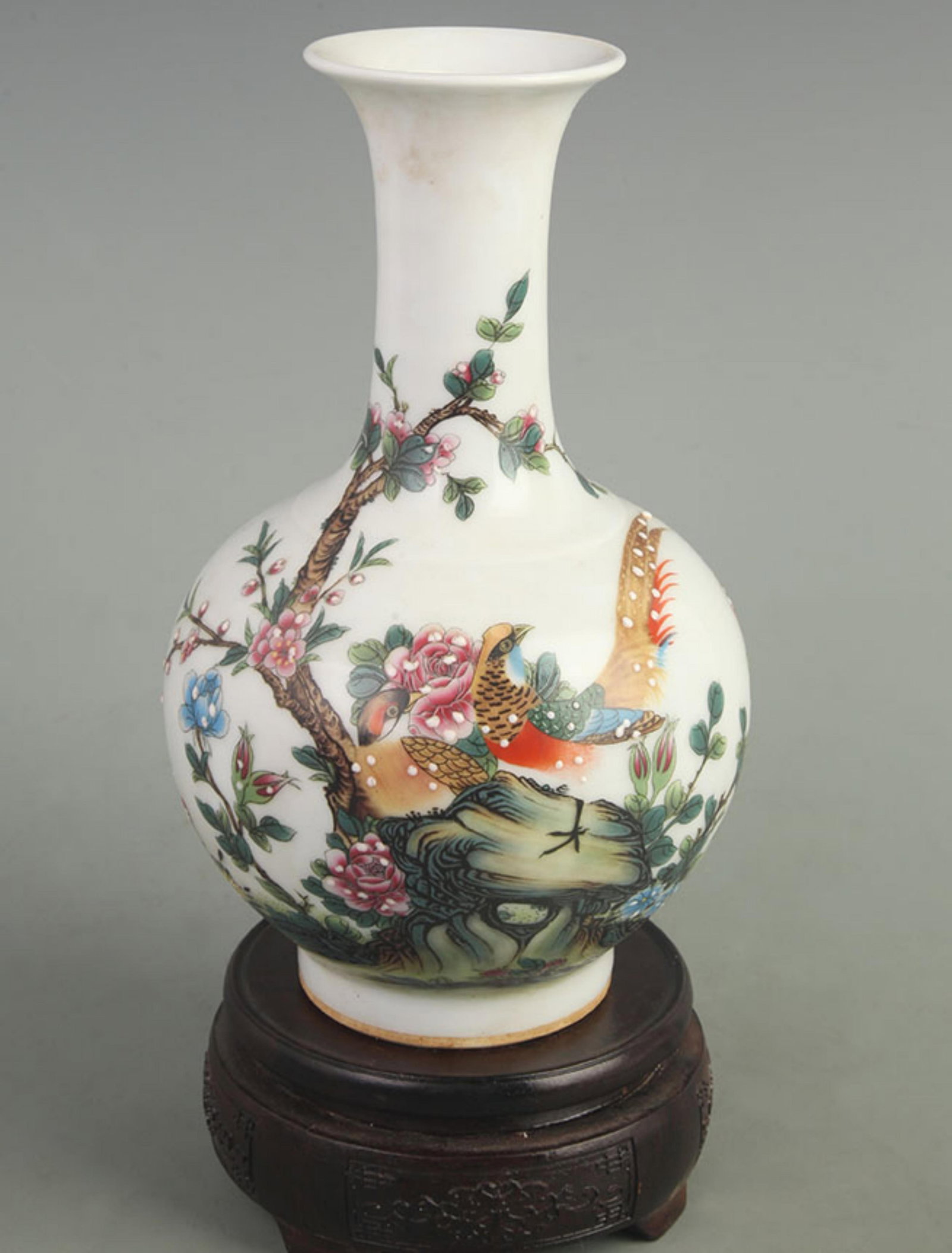 ENAMEL COLOR GROUND FLORAL AND BIRD PATTERN PORCELAIN VASE: Qing Dynasty Qian Long Period; High: 8.50 inch; Width: 4.80 inch; Woodbase for picture and display only