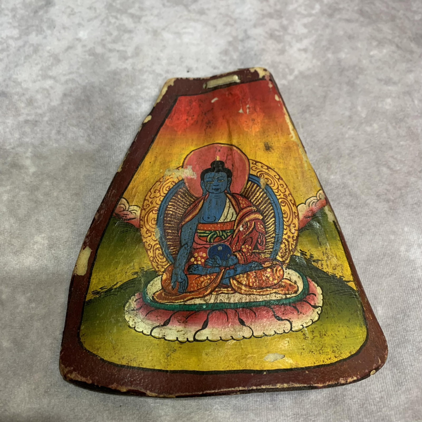 A TIBETAN BUDDHIST PAINTING ON OX BONE: 19th Century; High: 7.2 inch; Width: 6.3 inch ; Woodbase for picture and display only