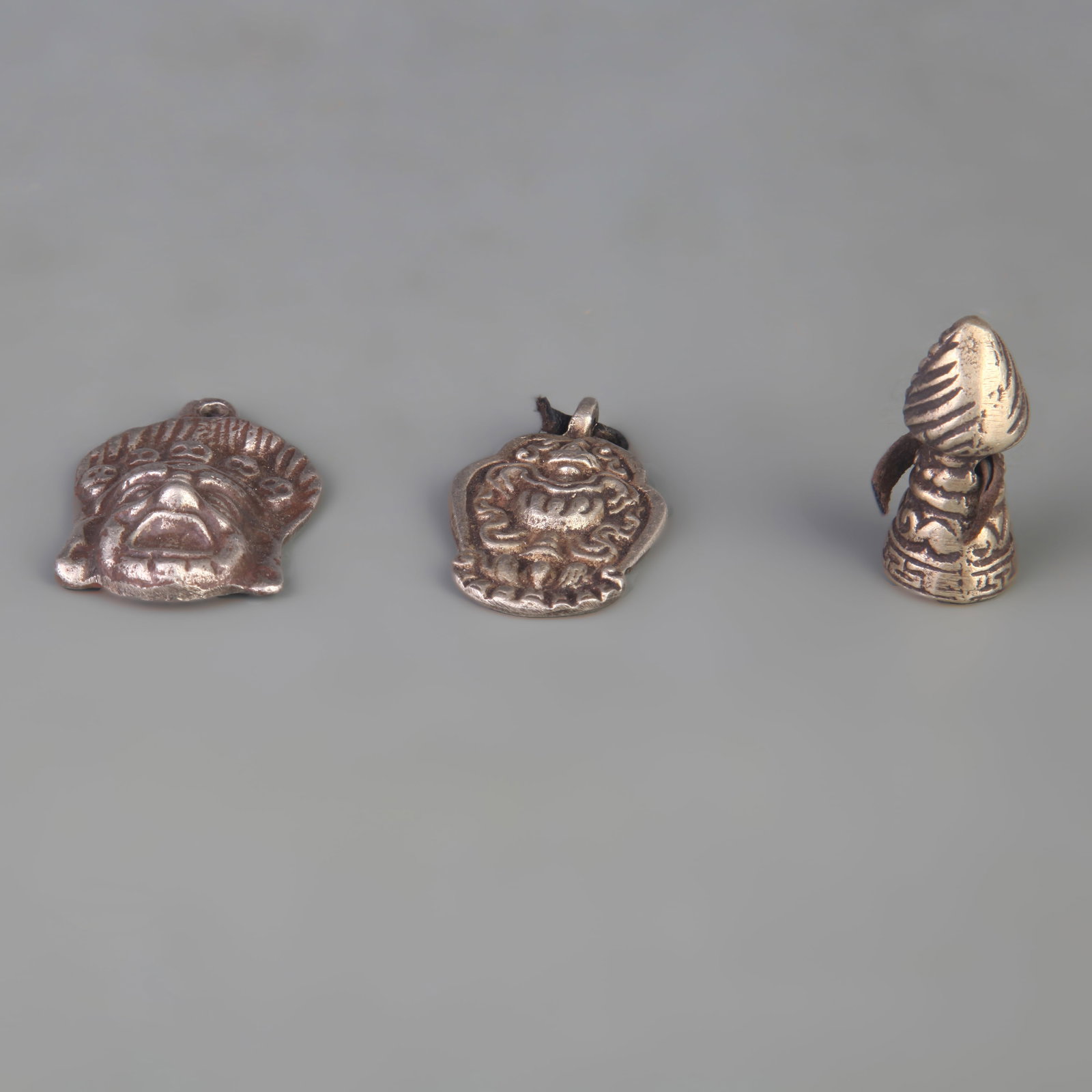 A GROUP OF THREE SMALL TIBETAN BUDDHIST RITUAL IMPLEMENTS: Qing Dynasty; Long: 1.4 inch to 1.9 inch; Width: 0.7 inch to 1.3 inch; Woodbase for picture and display only