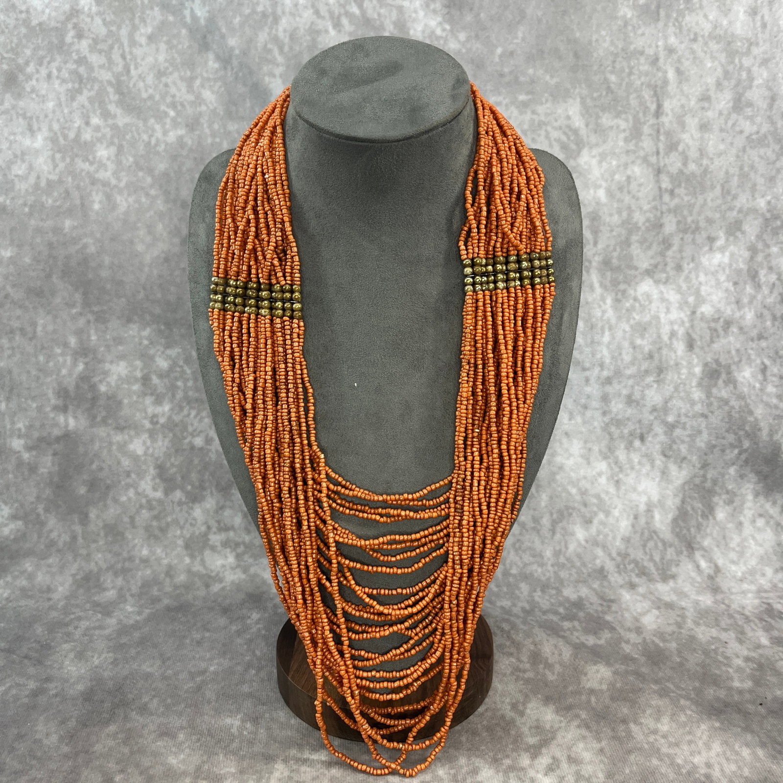 A SMALL RED GLASS BEAD TIBET STYLE NECKLACE: Modern; Long: 16 inch; Width:1.9 inch; Woodbase for picture and display only