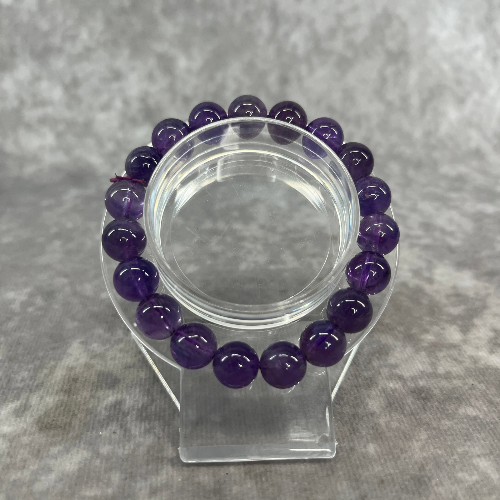 A FINE BLUE CRYSTAL MADE BRACELET: Modern; Long: 3.6 inch; Diameter: 0.4 inch; Woodbase for picture and display only