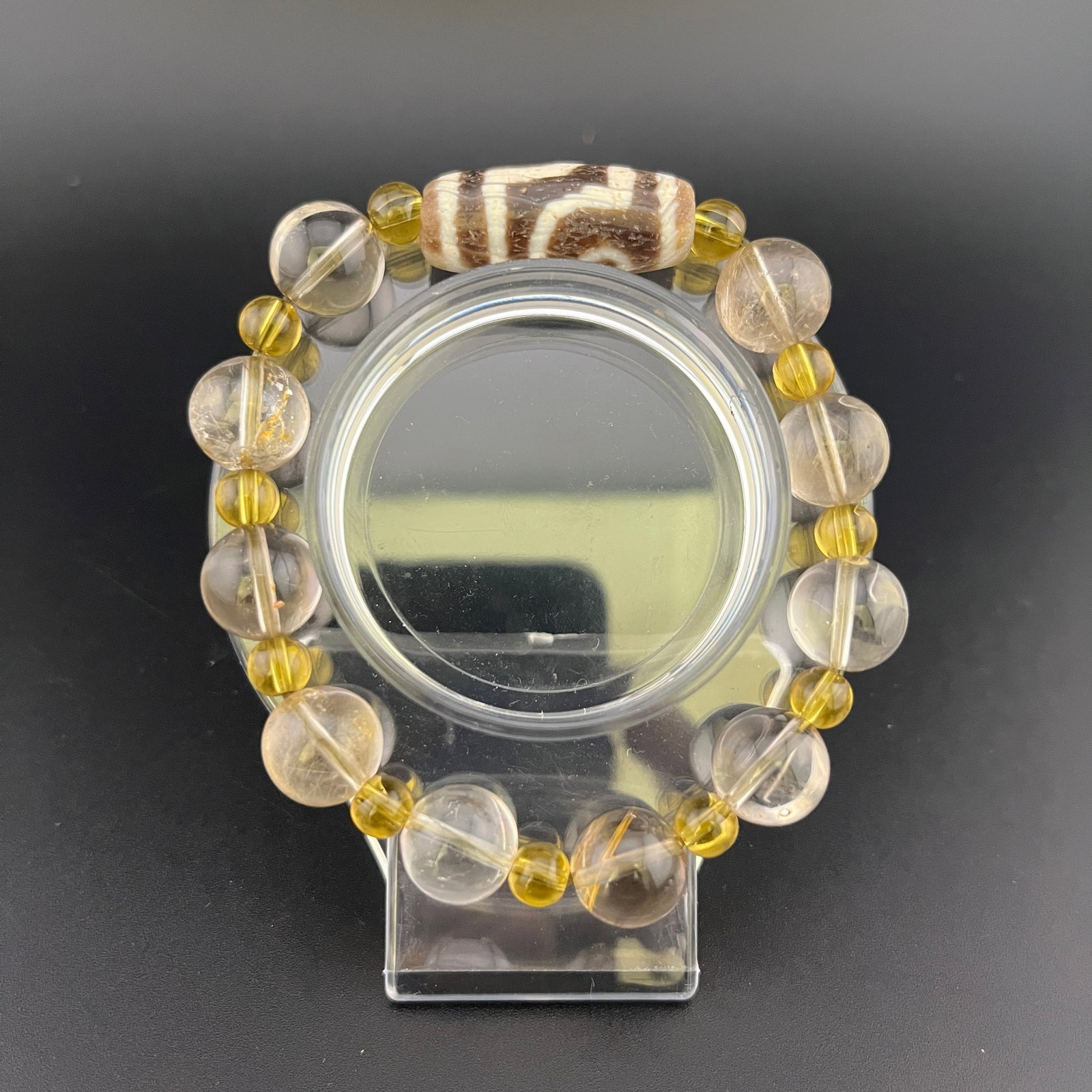 A FINE CRYSTAL AND TIAN ZHU MADE BRACELET: Modern; Long: 4.3 inch; Diameter: 0.48 inch; Woodbase for picture and display only