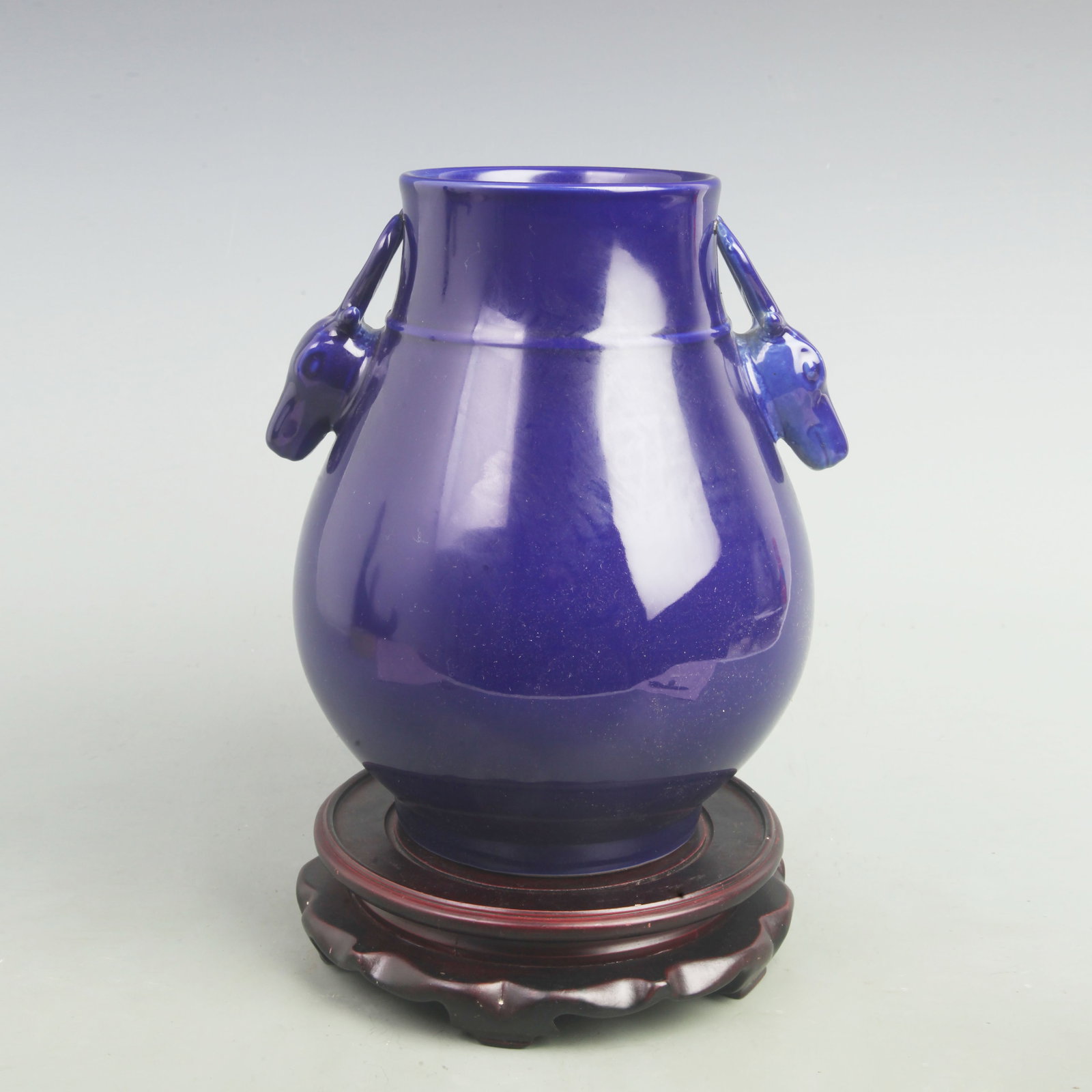 A SACRIFICIAL BLUE-GLAZED DEER-HEAD HANDLED ZUN VASE: Qing Dynasty Yong Zheng Period; High: 10.5 inch; Width: 8.5 inch; Woodbase for picture and display only