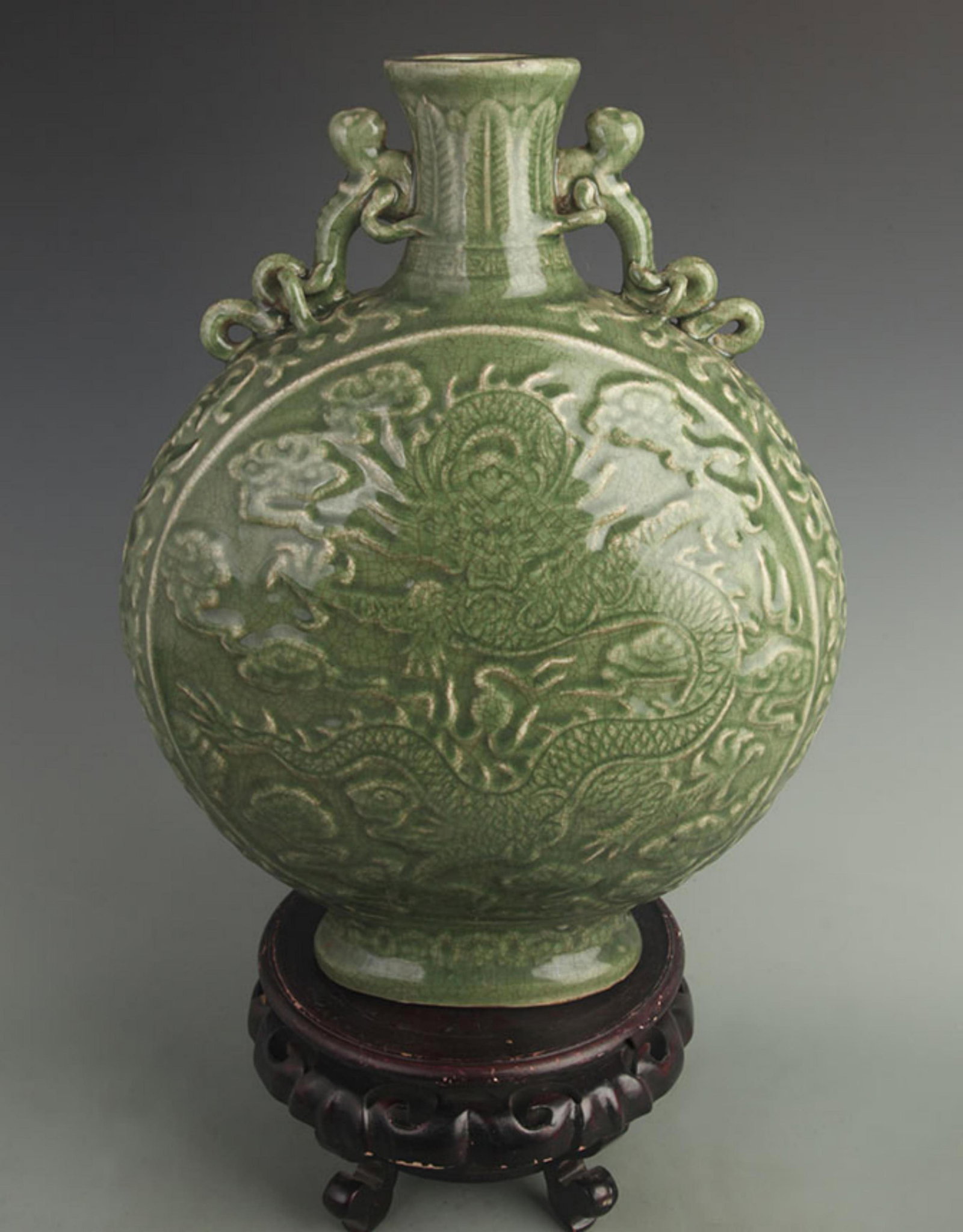 A LONG QUAN KILN DRAGON CARVING PORCELAIN VASE: Ming Dynasty Style, High: 16.8 inch; Width: 12.8 inch; Woodbase for picture and display only