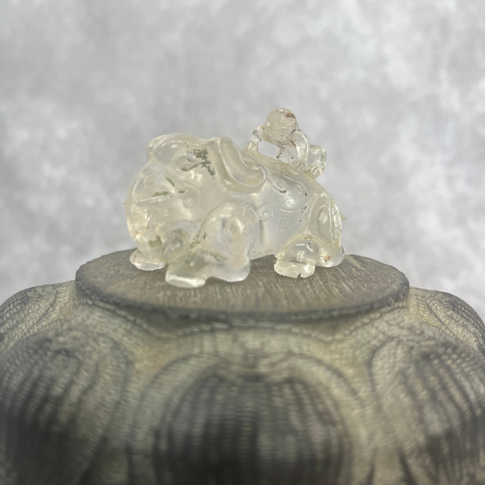 A FINE CRYSTAL MADE BOY PLAYING FIGURE: Modern; Long: 2 inch; Width:1.2 inch; Heigh: 1.3 inch; Woodbase for picture and display only