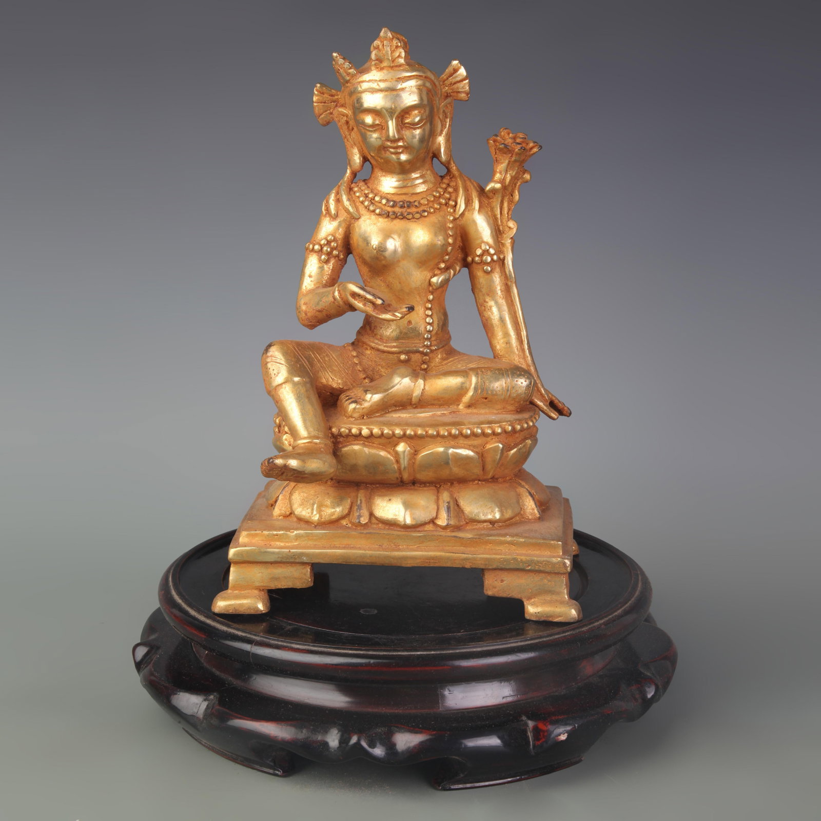 A RARE GILT-BRONZE FIGURE OF AVALOKITESHVARA: 15th Century; Width: 7.7 inch; High: 11.6 inch; Woodbase for picture and display only