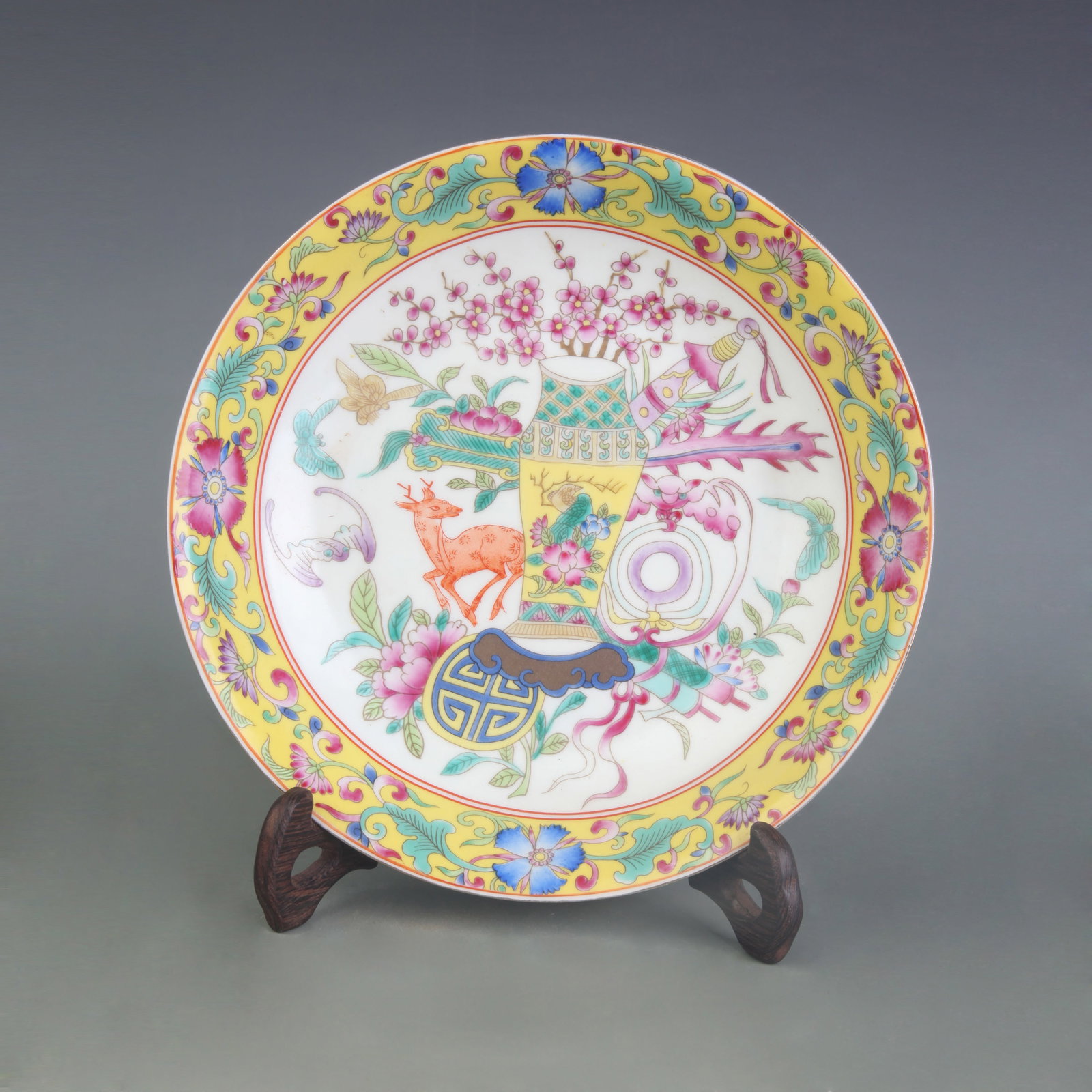 AN ENAMEL-PAINTED PLATE WITH FU, LU, AND SHOU MOTIFS: Qing Dynasty Yong Zheng Period; Diameter: 8.1 inch; Woodbase for picture and display only