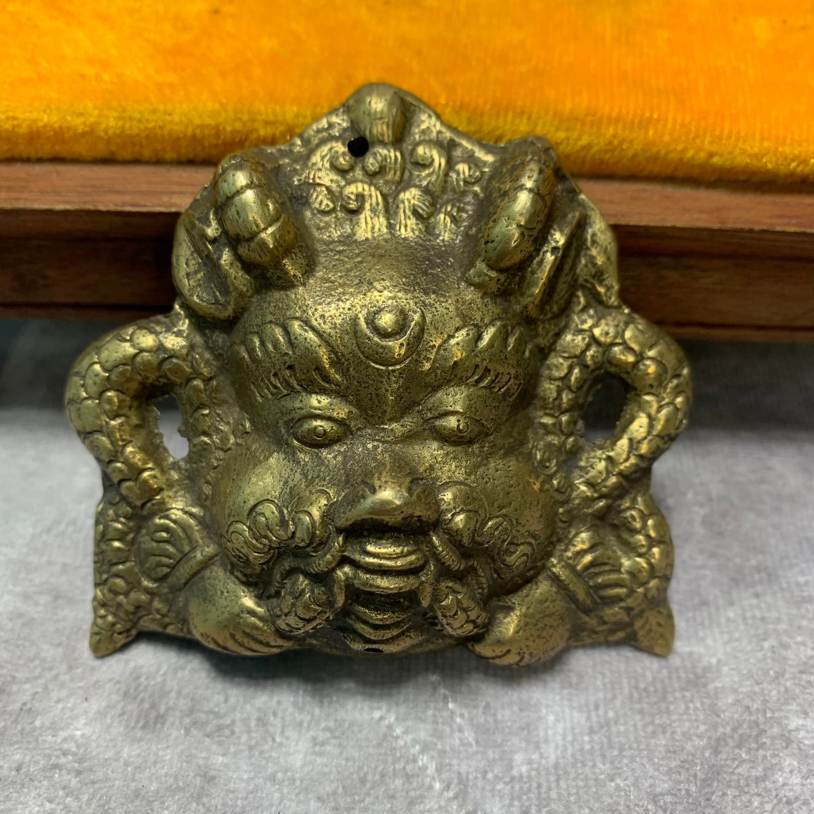 A TIBETAN BUDDHIST BRONZE RITUAL IMPLEMENT: Qing Dynasty; Long: 3 inch; Width: 2.8 inch; High: 0.6 inch; Woodbase for picture and display only