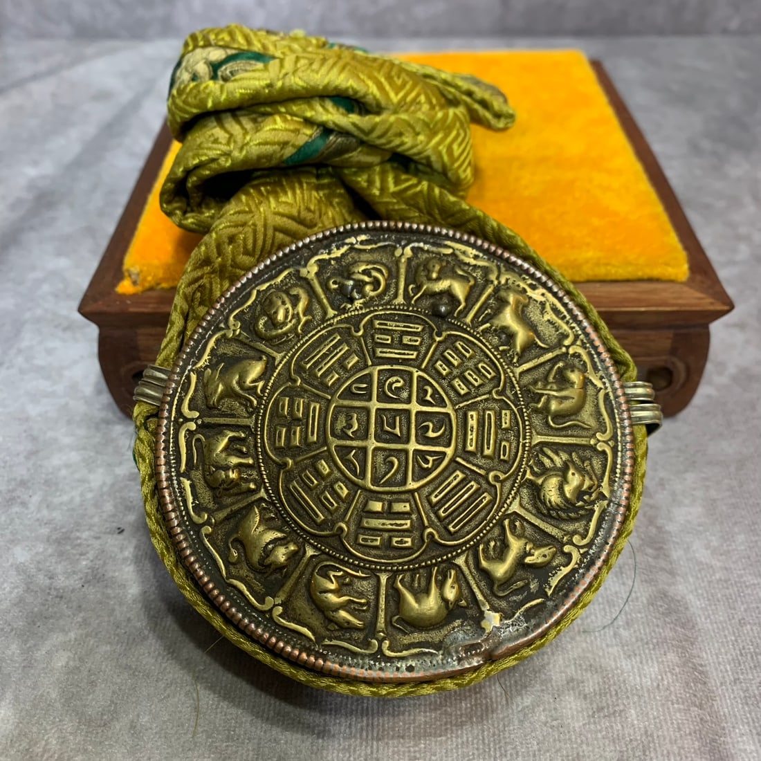 A FINE TIBETAN GAWU PENDANT: Modern; High: 3.6 inch; Width: 3.6 inch; Diameter: 1.3 inch ; Woodbase for picture and display only