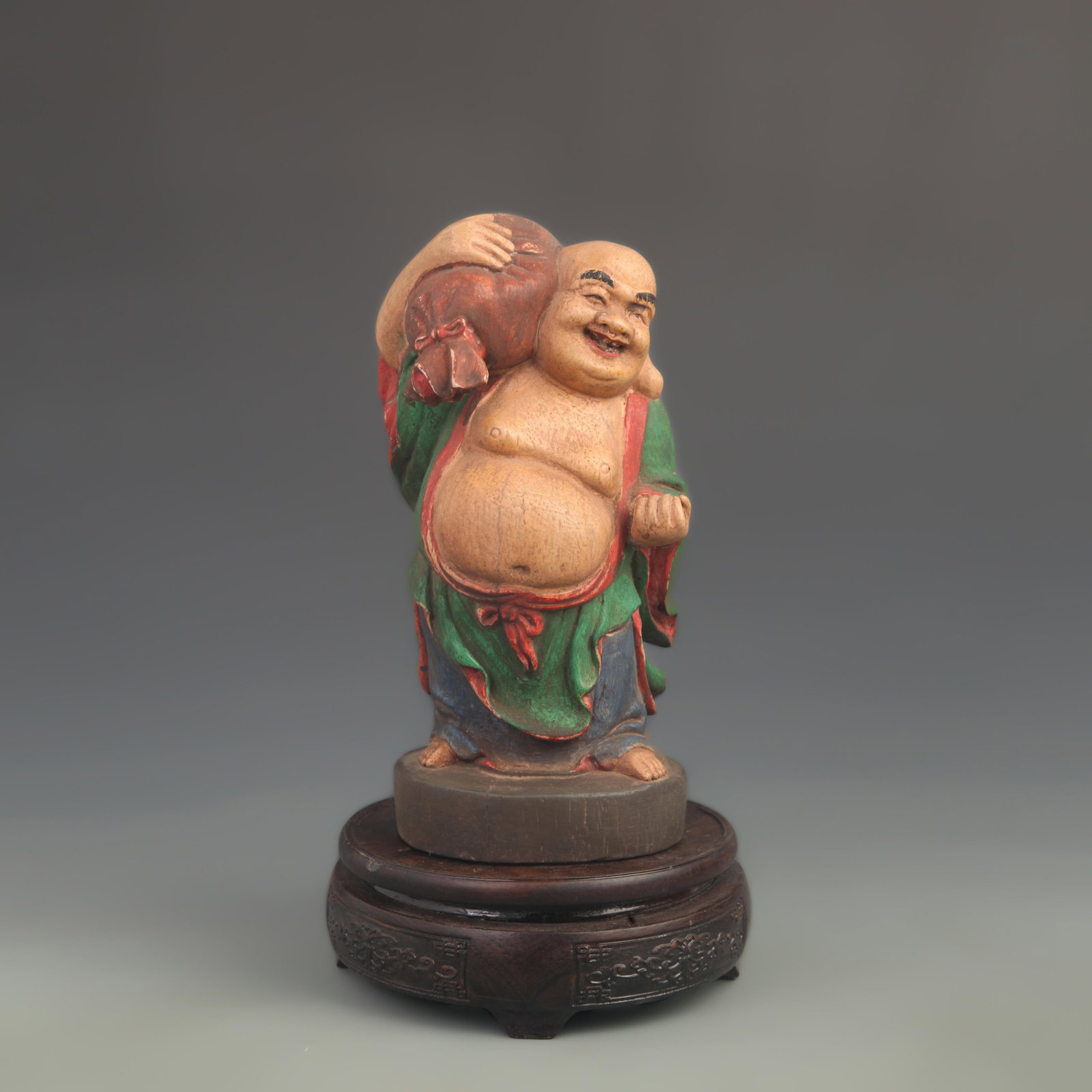 A WOOD-BODIED POLYCHROME PAINTED BUDAI (LAUGHING BUDDHA) FIGURE: 20th Century ; High: 8.00 inch; Width: 4.00 inch; Woodbase for picture and display only