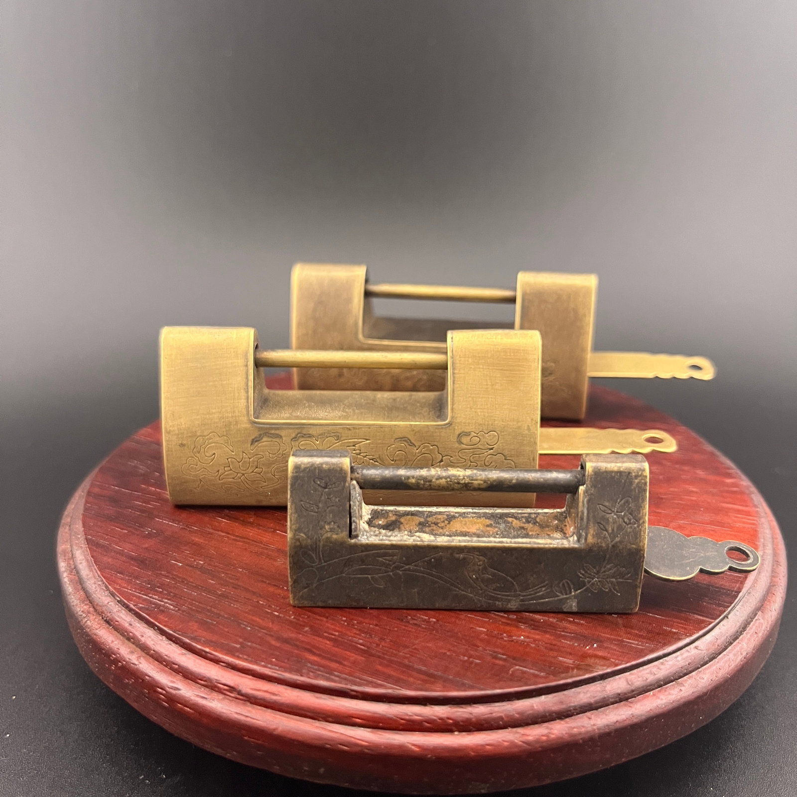 GROUP OF THREE CHINESE BRONZE LOCK: 19th Century; Long: 2.6 inch; Width: 1.2 inch; High: 0.68 inch; Woodbase for picture and display only