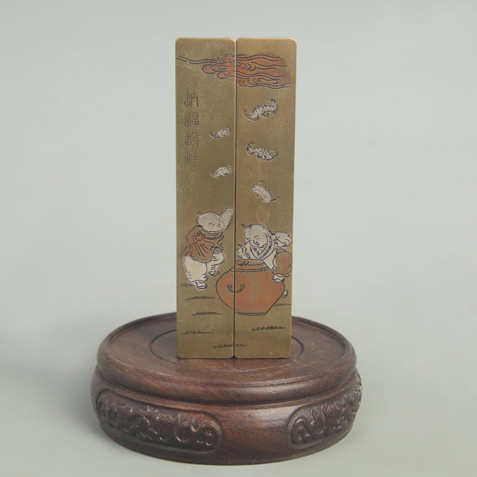 BRONZE AND SILVER INLAY NE ZHA NAO HAI FIGURE PAPER WEIGHT: Republic Period; High: 4.25 inch; Width: 0.75 inch; Woodbase for picture and display only