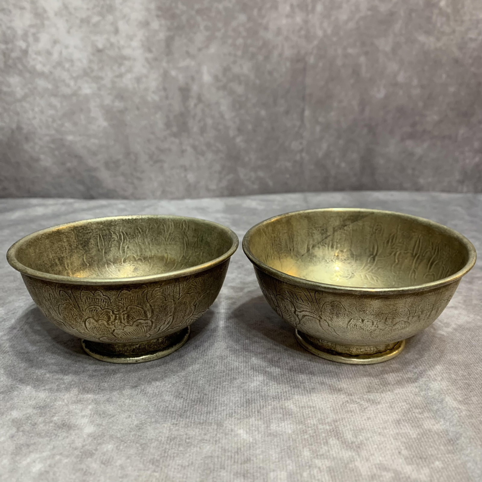 PAIR OF FINELY CARVED WHITE BRONZE CUP: Modern; High: 1.8 inch; Diameter: 4.1 inch; Woodbase for picture and display only