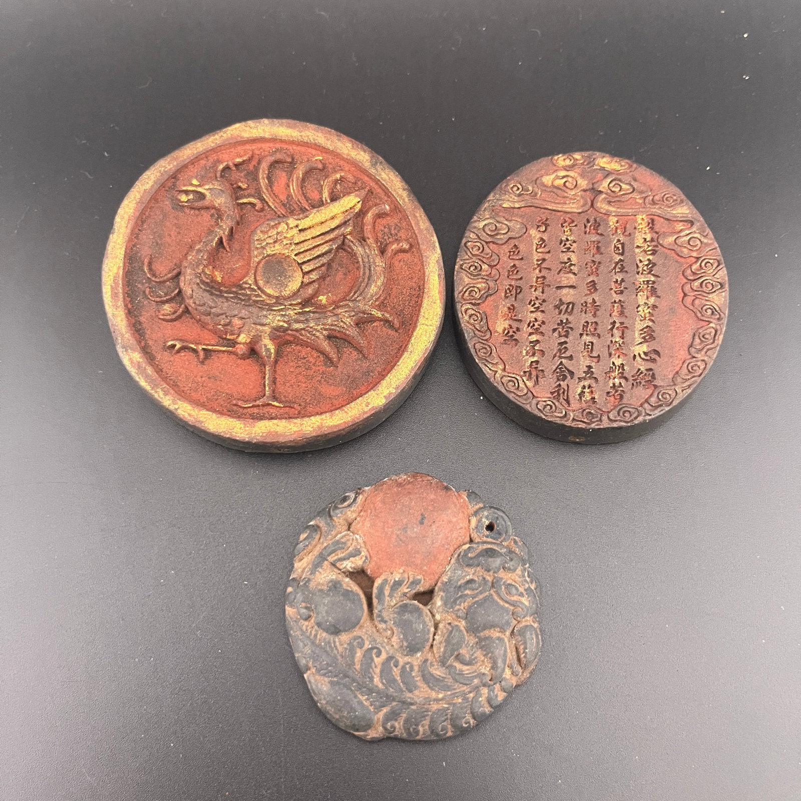 GROUP OF THREE CHINESE HERBAL AND MEDICINE MADE PENDANT: Modern; Heigh: 0.58 inch; Diameter: 2.8 inch; Long: 2.8 inch; Width:2.3 inch; Heigh: 0.42 inch; Heigh: 0.32 inch; Diameter: 2 inch; Woodbase for picture and display only