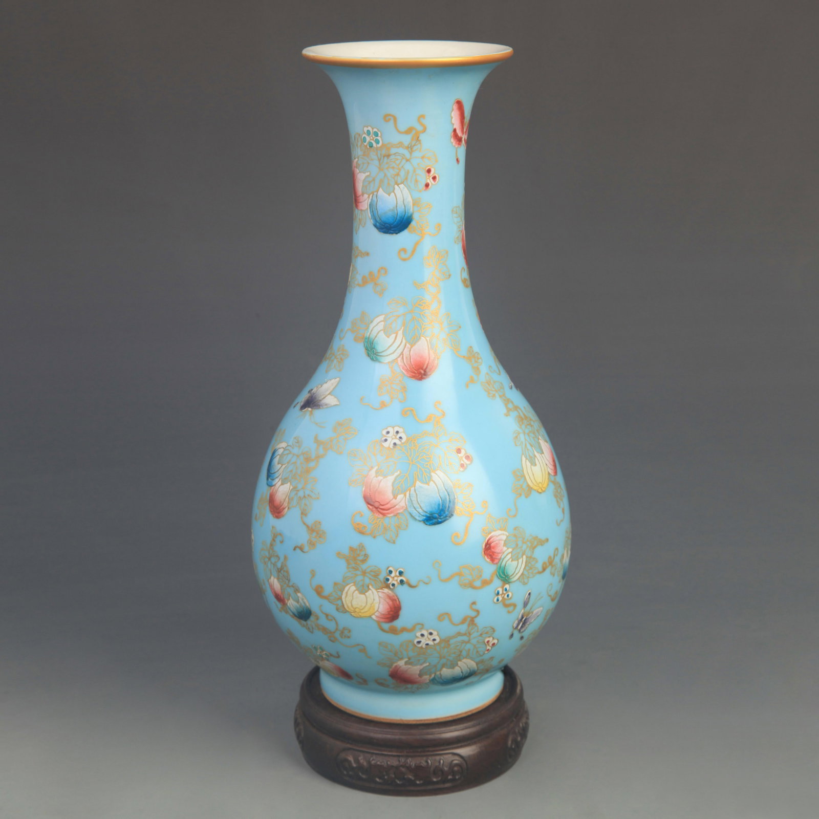 A FAMILLE ROSE BLUE-GROUND BUTTERFLY PORCELAIN VASE: Qing Dynasty Qian Long Period; High: 10.8 inch;Diameter: 5.00 inch; Woodbase for picture and display only
