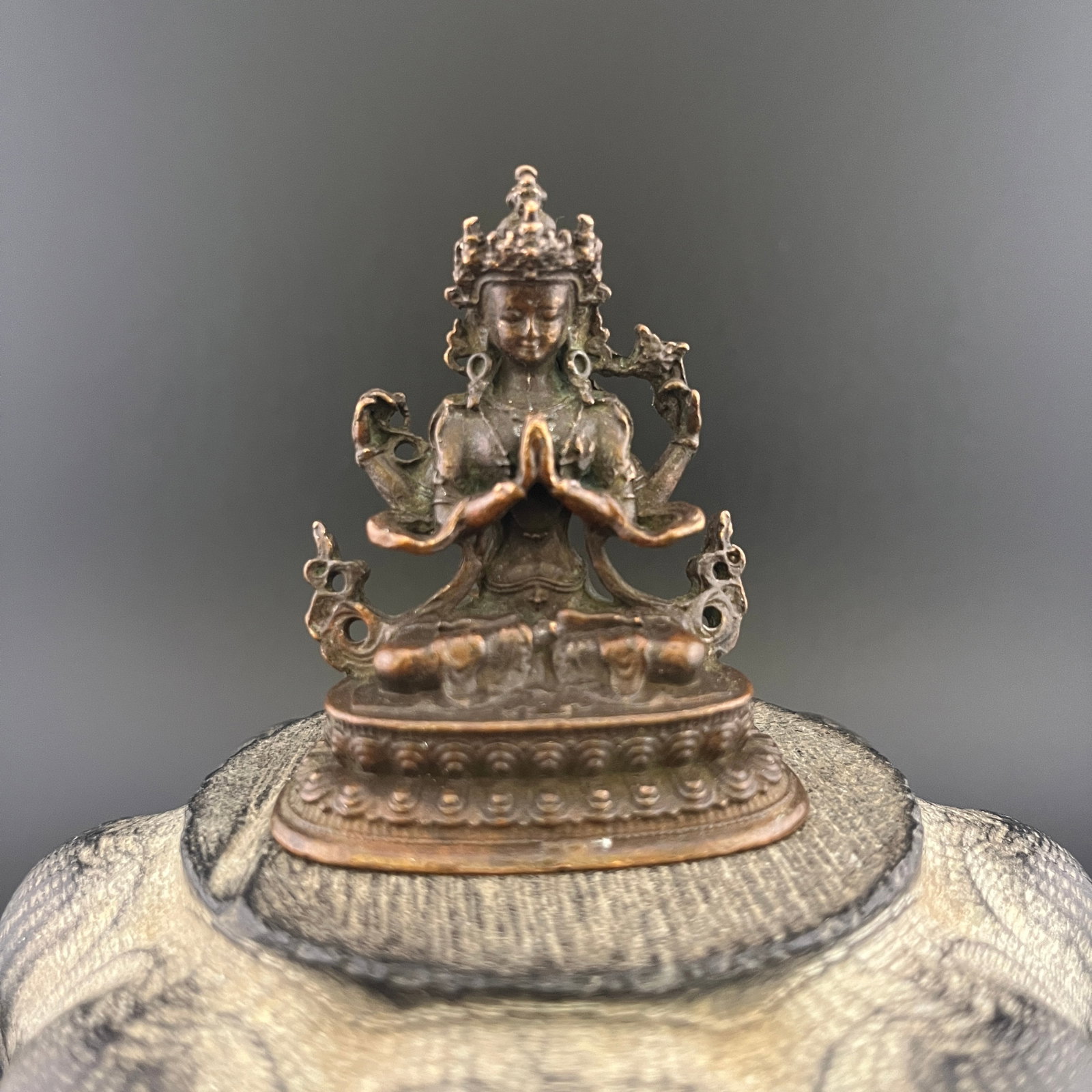 A SMALL BRONZE THOUSAND HAND GUANYIN BODHISATTVA: 19th Century; Long: 1.48 inch; Width:2.05 inch; Heigh: 2.4 inch; Woodbase for picture and display only
