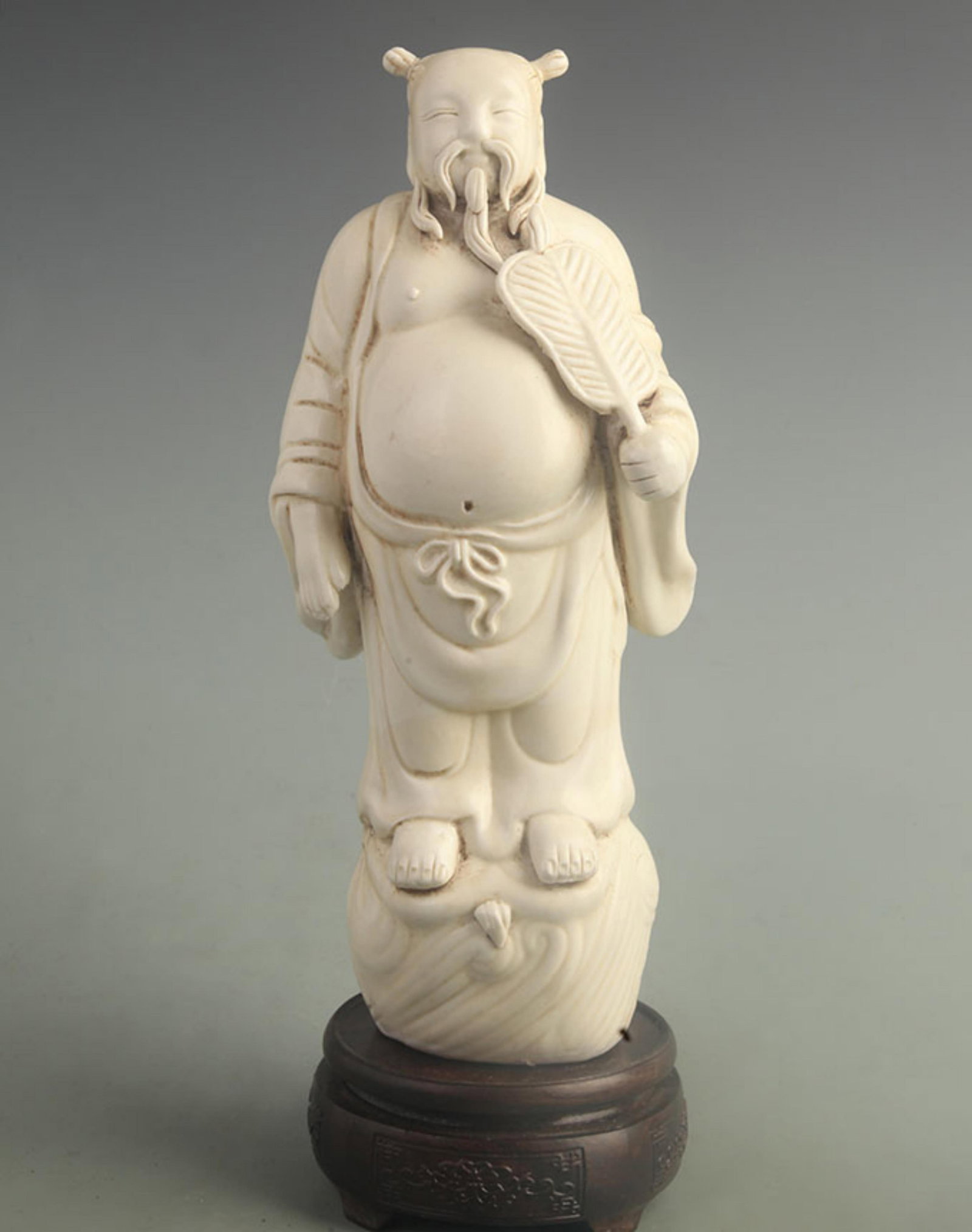 A DEHUA PORCELAIN FIGURE OF ZHONGLI QUAN (EIGHT IMMORTALS) (1 of 6)