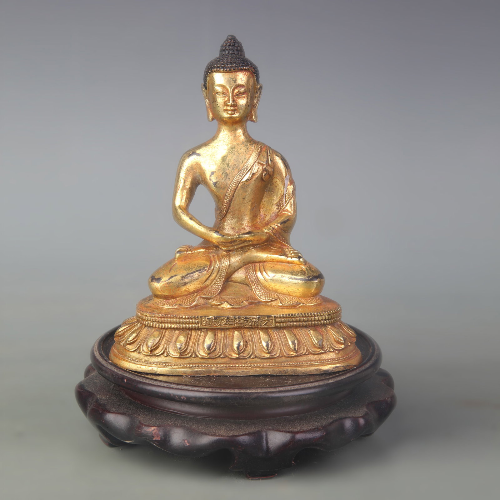 GILT BRONZE SHAKYAMUNI BUDDHA STATUE: Qing Dynasty Qian Long Period; Width: 4.4 inch; High: 5.4 inch; Woodbase for picture and display only