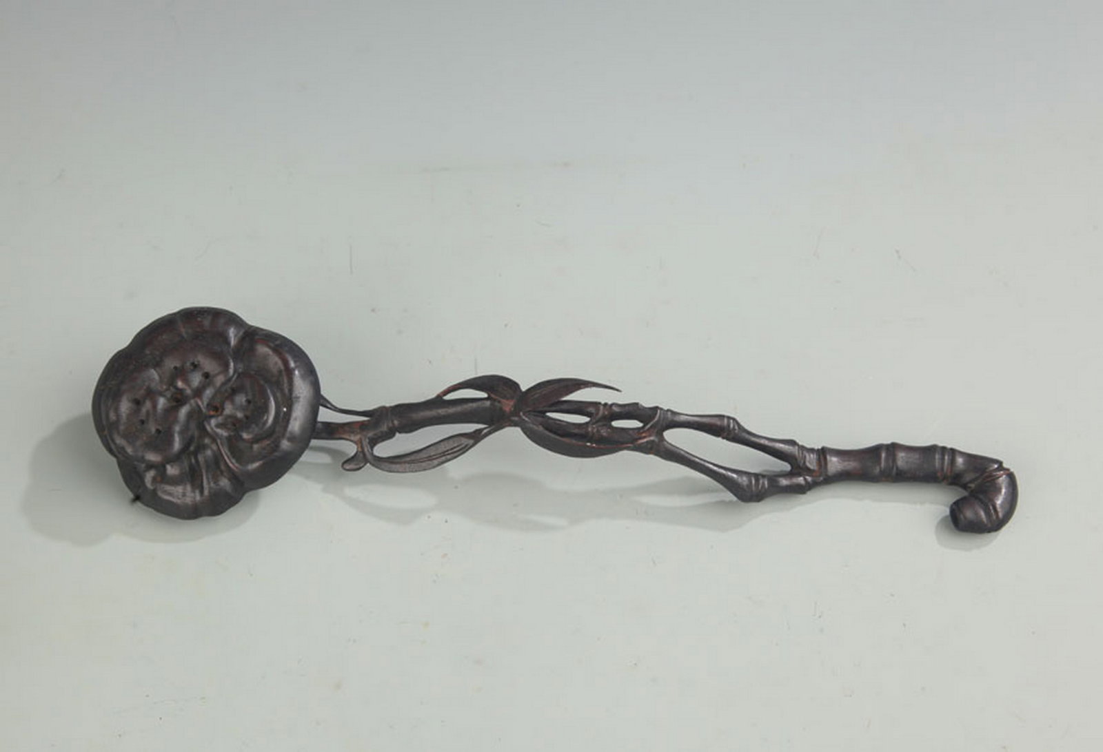 A SANDALWOOD CARVED RUYI SCEPTRE: Qing Dynasty; Long: 11.75 inch; Width: 3.0 inch; Woodbase for picture and display only