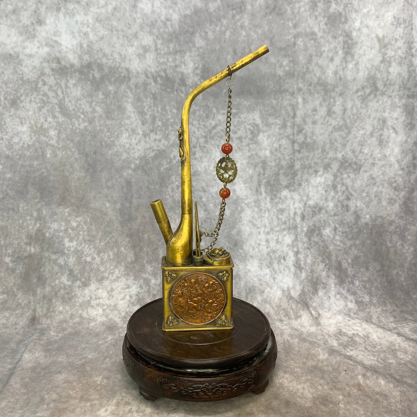 A FINE BRONZE WATER SMOKING PIPE (1 of 5)