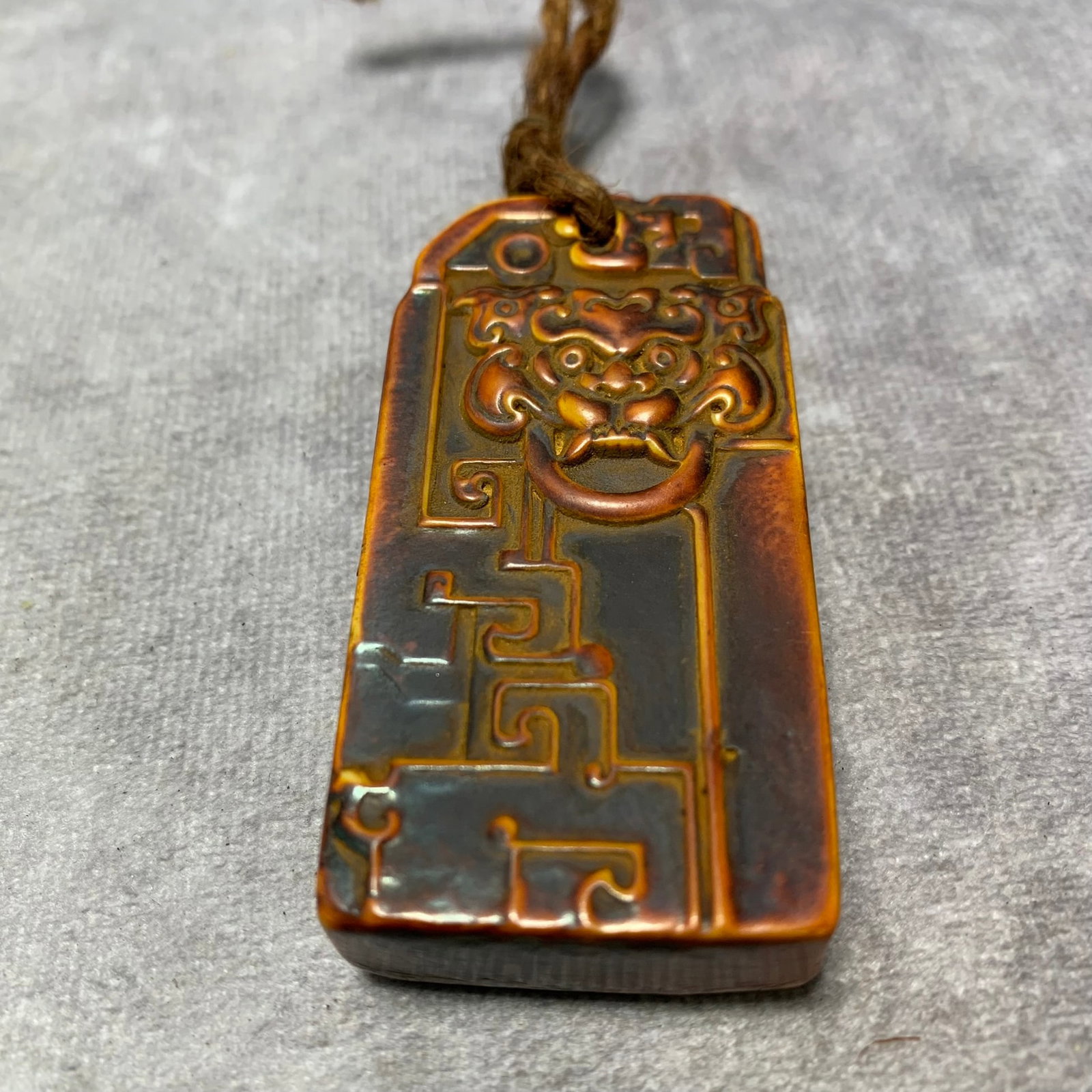 A FINE BONE PLAQUE WITH LION DESIGN: Ming Dynasty; Long: 2.7 inch; Width: 1.4 inch; H; 0.6 inch; Woodbase for picture and display only