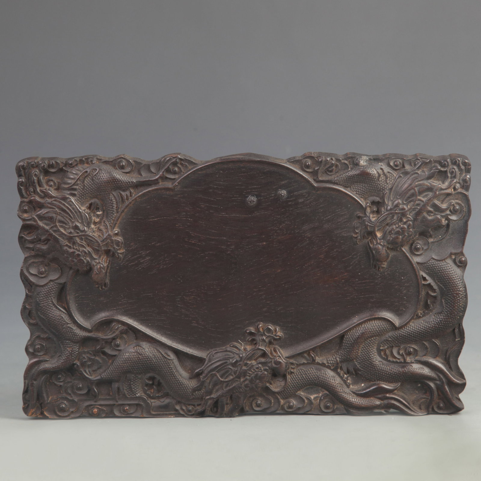 EBONY WOOD CARVED INKSTONE WITH SEA AND DRAGON PATTERNS: 20th Century; Long: 9.00 inch; Width: 5.25 inch; Woodbase for picture and display only