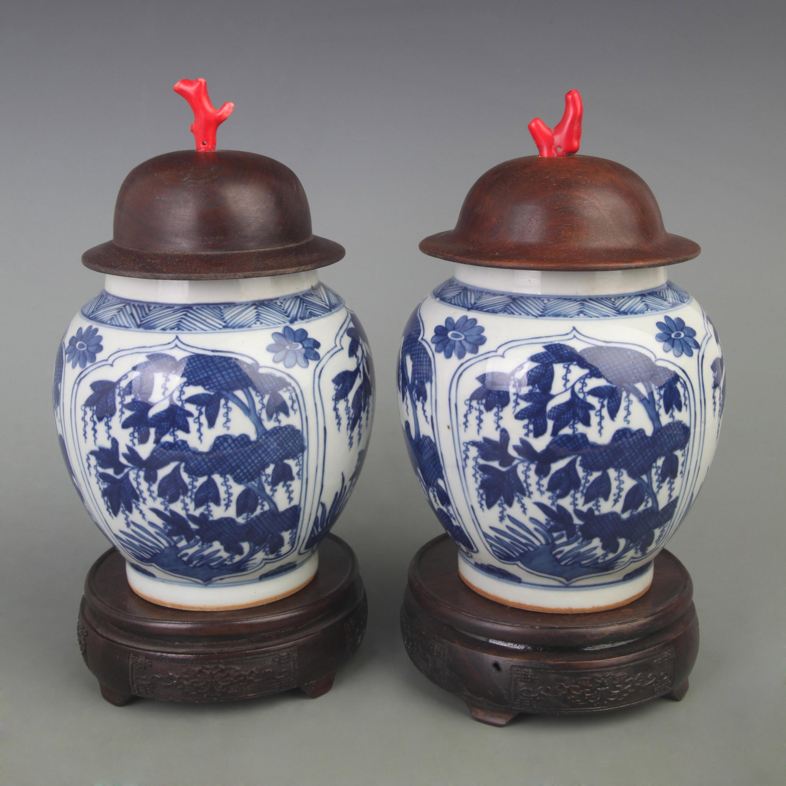 PAIR OF BLUE AND WHITE FLORAL PANELLED GENERAL JARS WITH HARDWOOD COVERS AND CORAL FINIALS (1 of 7)