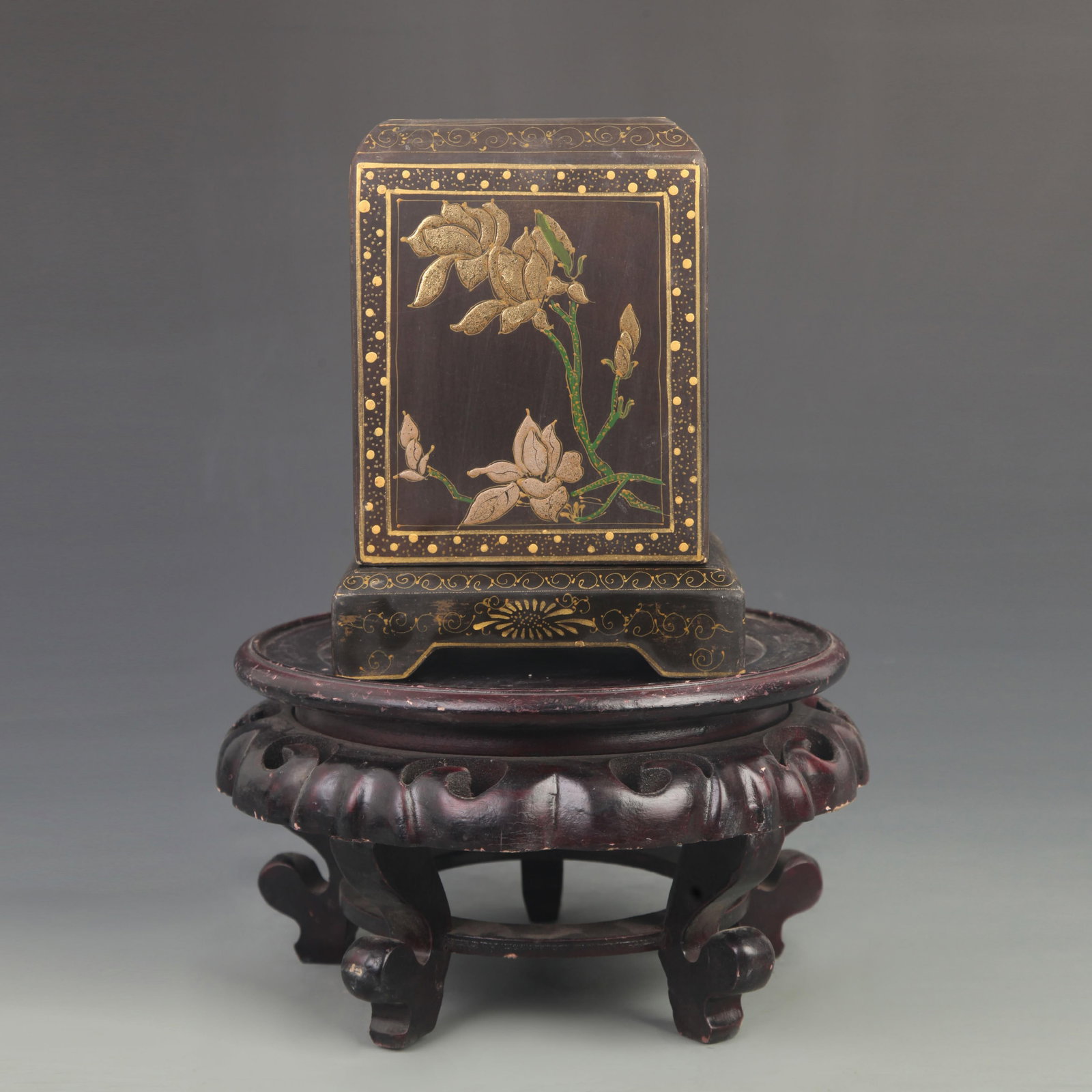 A BLACK LACQUER GILT-DECORATED SEAL BOX WITH FLORAL AND LONGEVITY PEACH MOTIFS: Qing Dynasty; High: 7.50 inch; Width: 4.75 inch; Woodbase for picture and display only