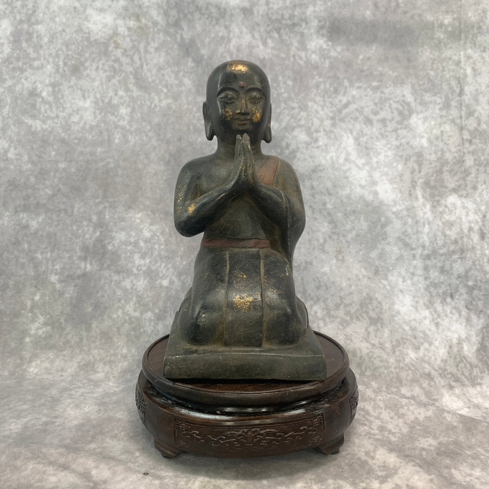 BRONZE FIGURE OF A KNEELING BUDDHIST MONK: 19th Century; Long: 4.4 inch; Width:4.6 inch; Heigh: 8.8 inch; Woodbase for picture and display only