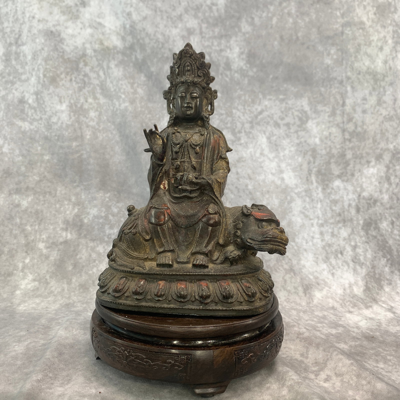 A FINE BRONZE BODHISATTVA MANJUSHRI ON A LION: Qing Dynasty; Long: 6.1 inch; Width:3.8 inch; Heigh: 8.5 inch; Woodbase for picture and display only