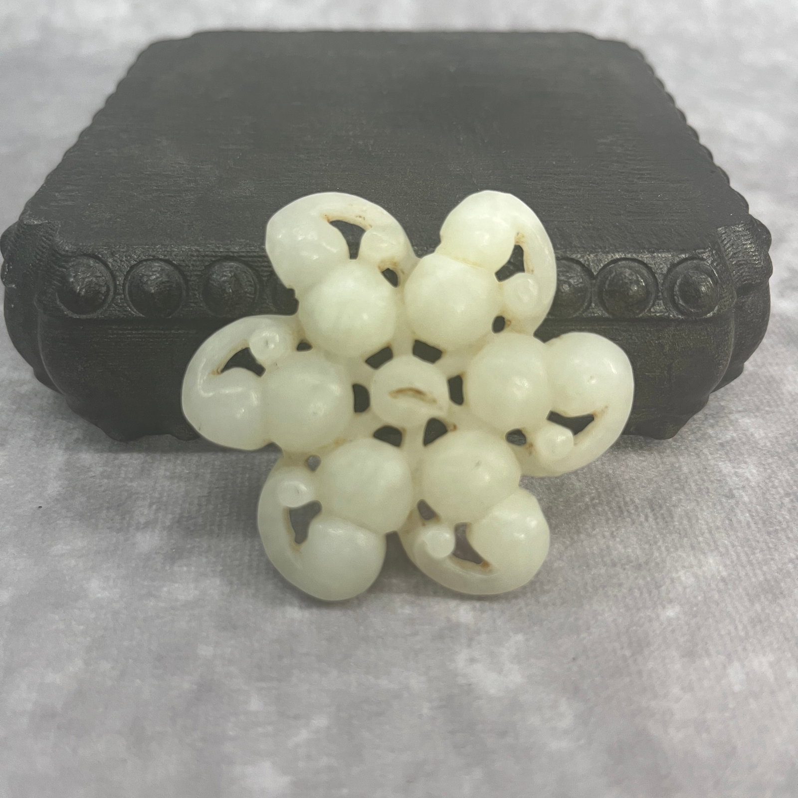 A FINE HETIAN JADE PENDANT IN FIGURE OF SIX GROUND: Qing Dynasty; High: 0.4 inch; Diameter: 2.12 inch; Woodbase for picture and display only