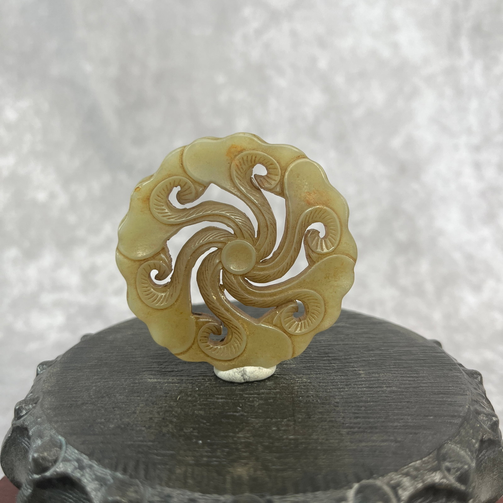 A FINE HETIAN JADE IN FIGURE OF REISHI MUSHROOM: Qing Dynasty; High: 0.19 inch; Diameter: 2 inch; Woodbase for picture and display only