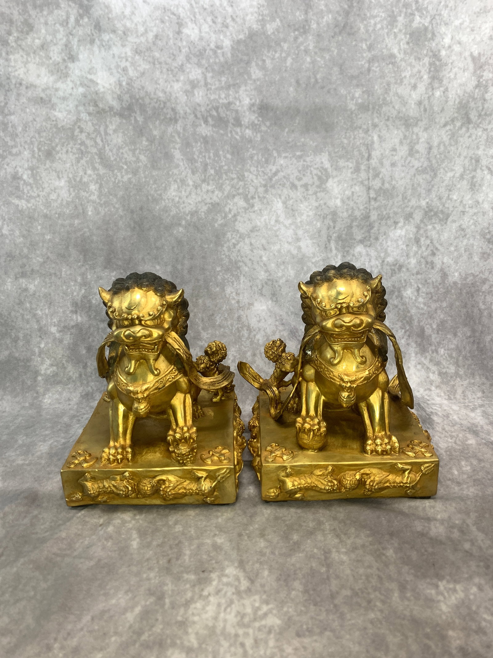 RARE GILT BRONZE PAIR OF CHINESE GUARDIAN LIONS, FOO DOGS: Qing Dynasty; Long: 6.7 inch; Width:6.7 inch; Heigh: 7.9 inch; Woodbase for picture and display only