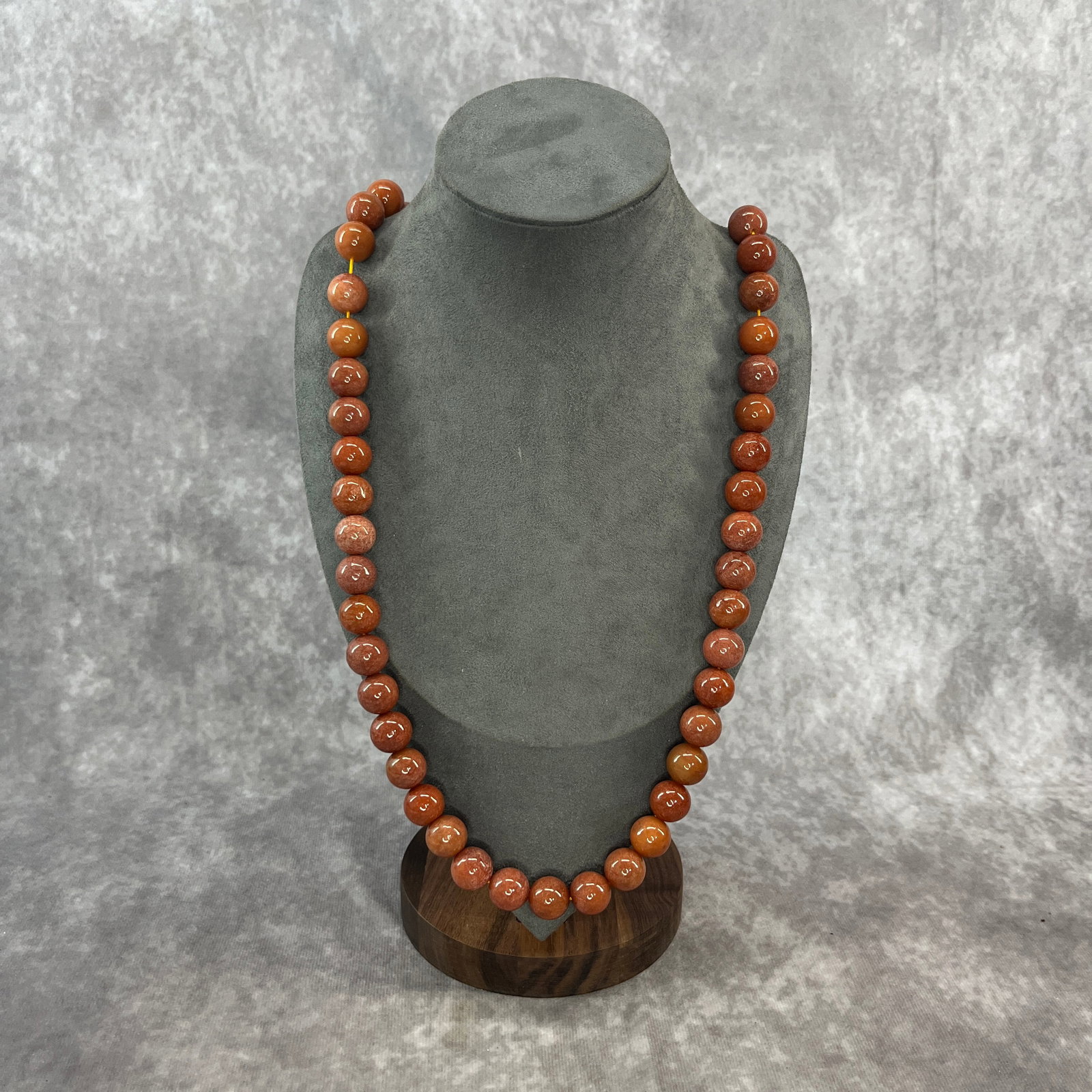 A FINE JADE MADE NECKLACE: Modern; Long: 15.2 inch; Diameter: 0.52 inch; Woodbase for picture and display only