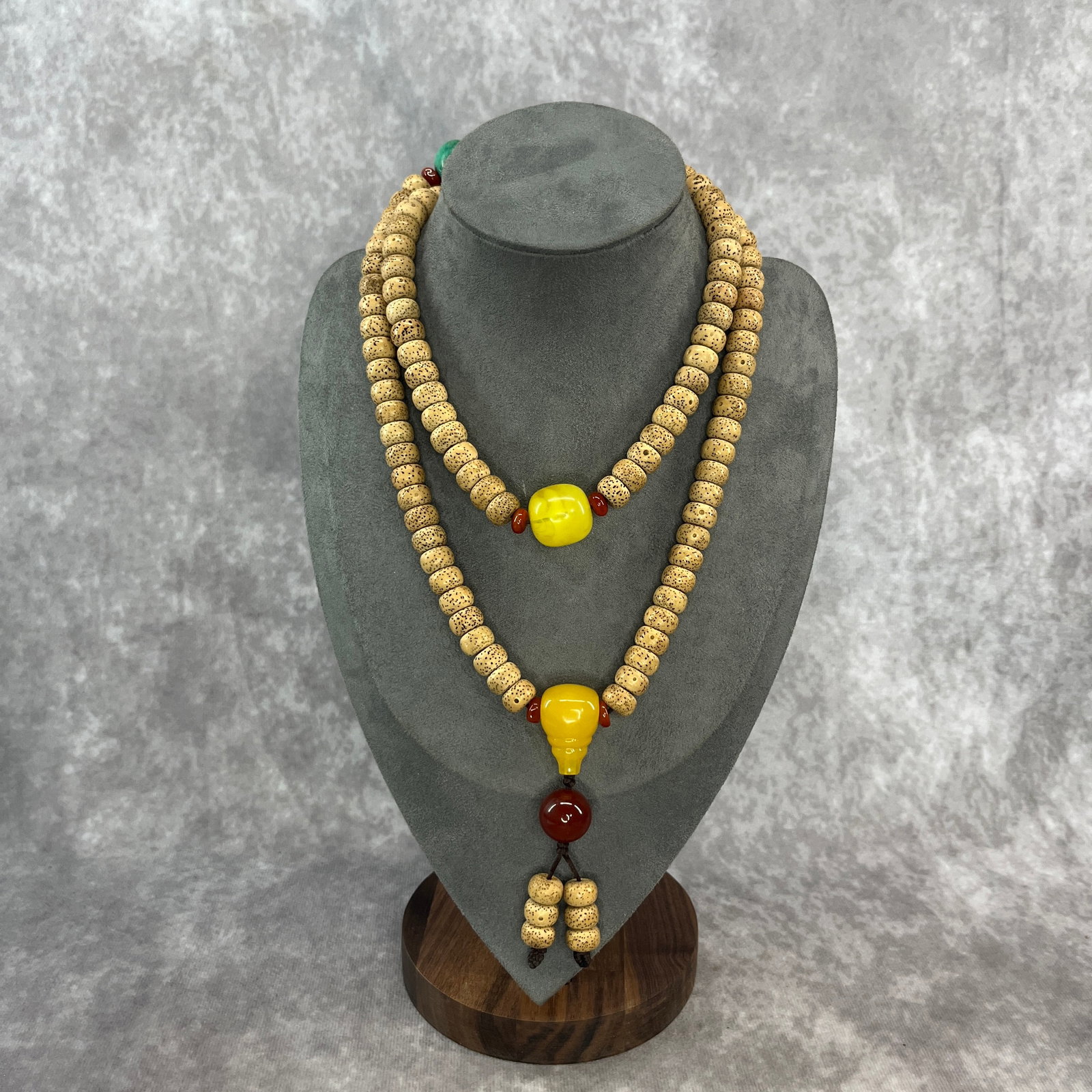 A FINE BUDDHIST BODHI SEED AND BEESWAX MADE PRAYER BEADS: Modern; Long: 17.5 inch; Diameter: 0.4 inch; Woodbase for picture and display only