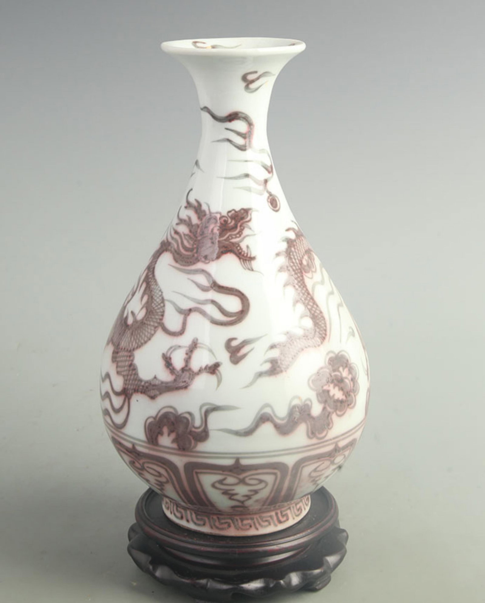 AN UNDERGLAZE RED DRAGON PATTERN YU HU CHUN STYLE PORCELAIN VASE: Yuan Dynasty Style; High: 11.8 inch; Width: 5.50 inch; Woodbase for picture and display only