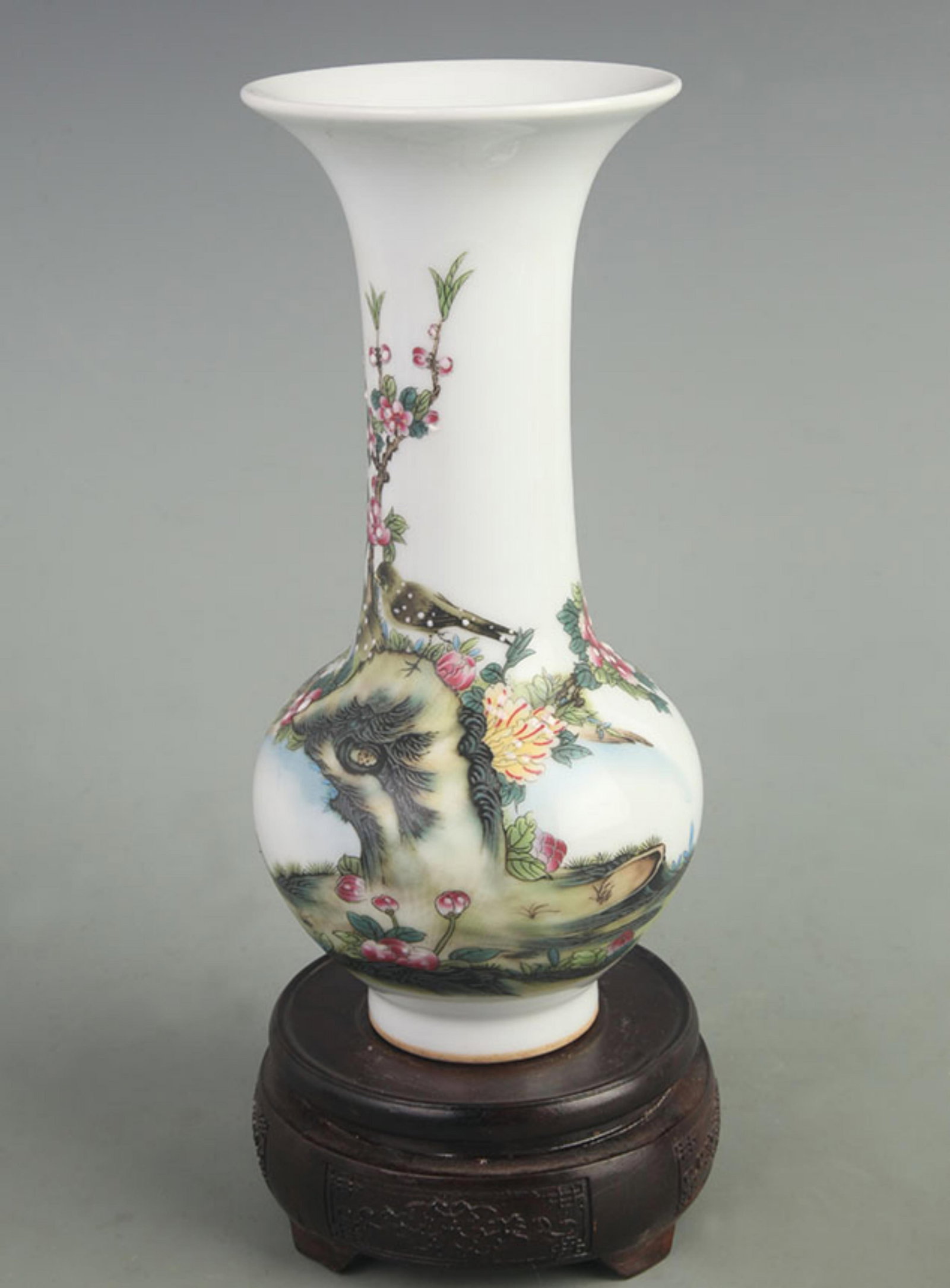 AN ENAMEL-PAINTED GU VASE WITH FLORAL AND BIRD DECORATION: Qing Dynasty Qian Long Period; High: 9.00 inch; Diameter: 4.00 inch; Woodbase for picture and display only