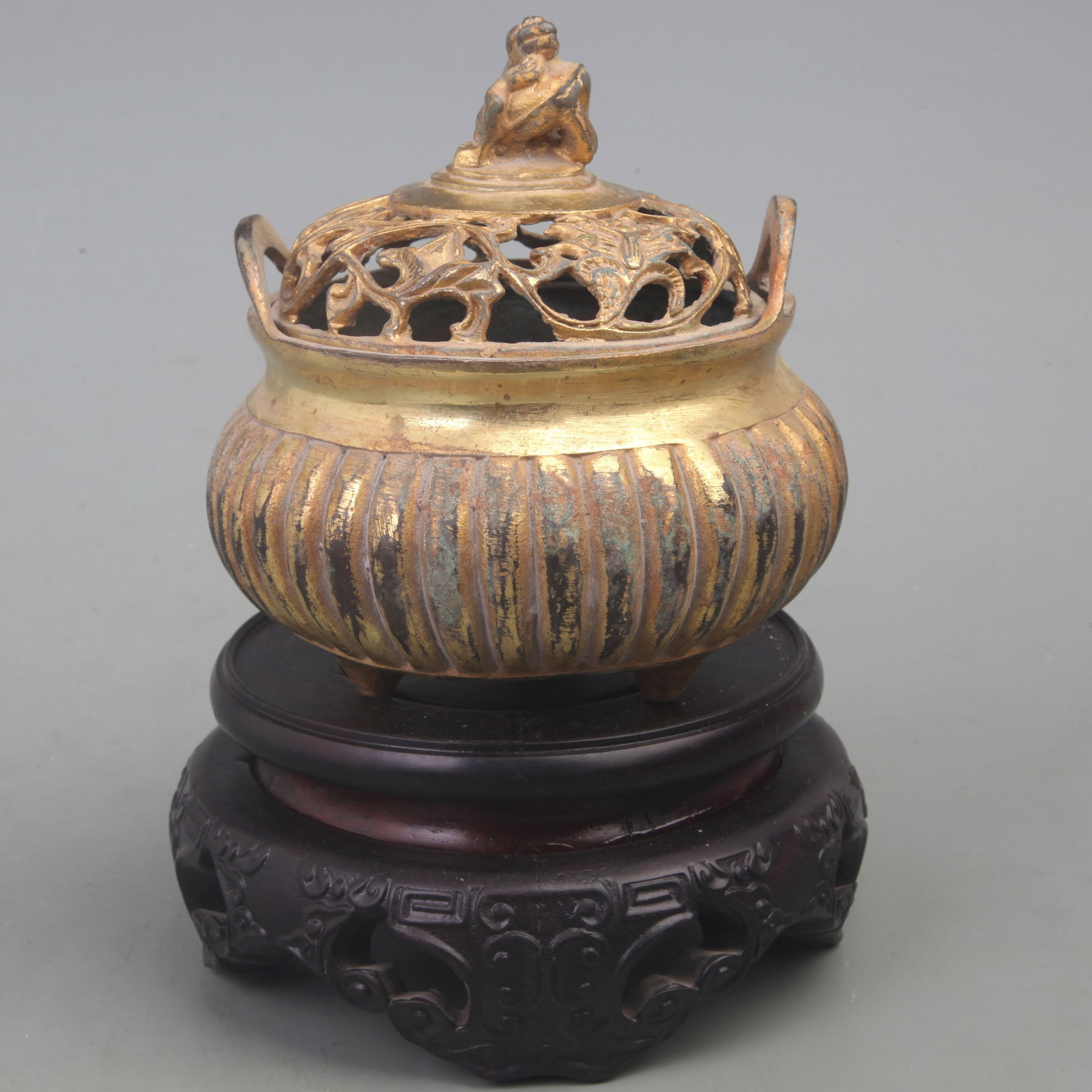 FLOWER AND DRAGON TOP THREE-LEGGED BRONZE INCENSE BURNER: Ming Dynasty; Diameter: 4.5 inch; High: 5.0 inch; Woodbase for picture and display only