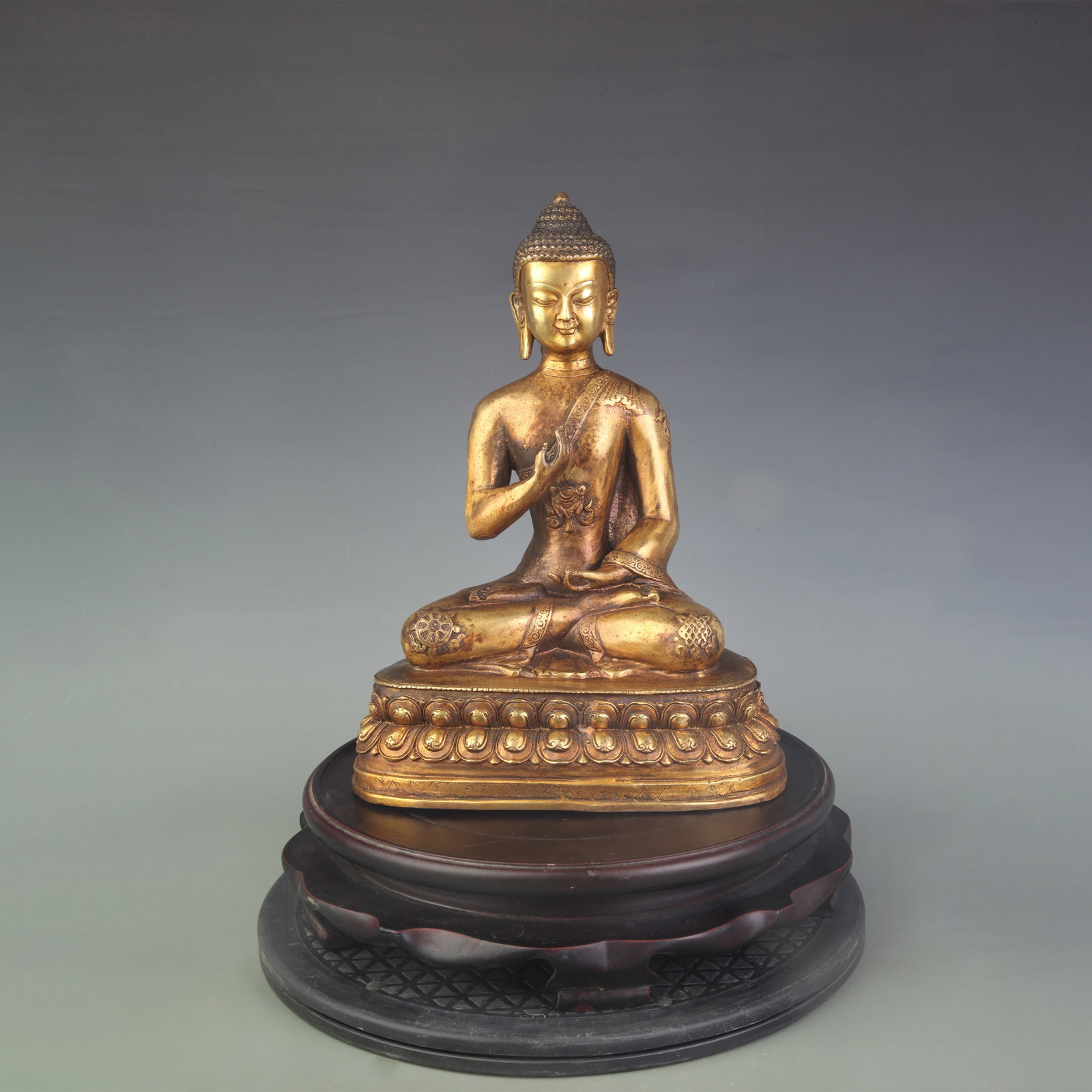 GILT-BRONZE BHAISAJYAGURU (MEDICINE BUDDHA): Qing Dynasty; High: 11.2 inch; Woodbase for picture and display only