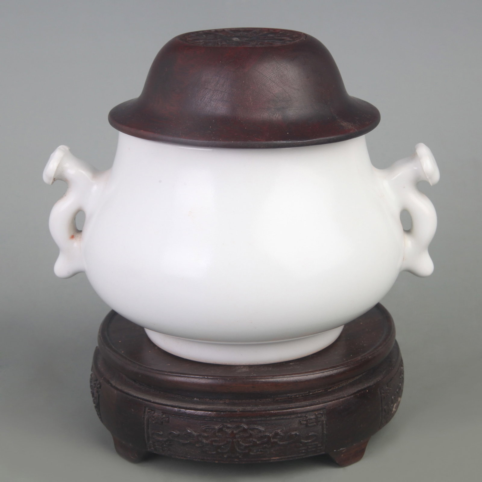 A WHITE GLAZED PORCELAIN INCENSE BURNER WITH RED WOOD COVER: Qing Dynasty; Diameter:6.2 inch; High: 5.3 inch; Woodbase for picture and display only