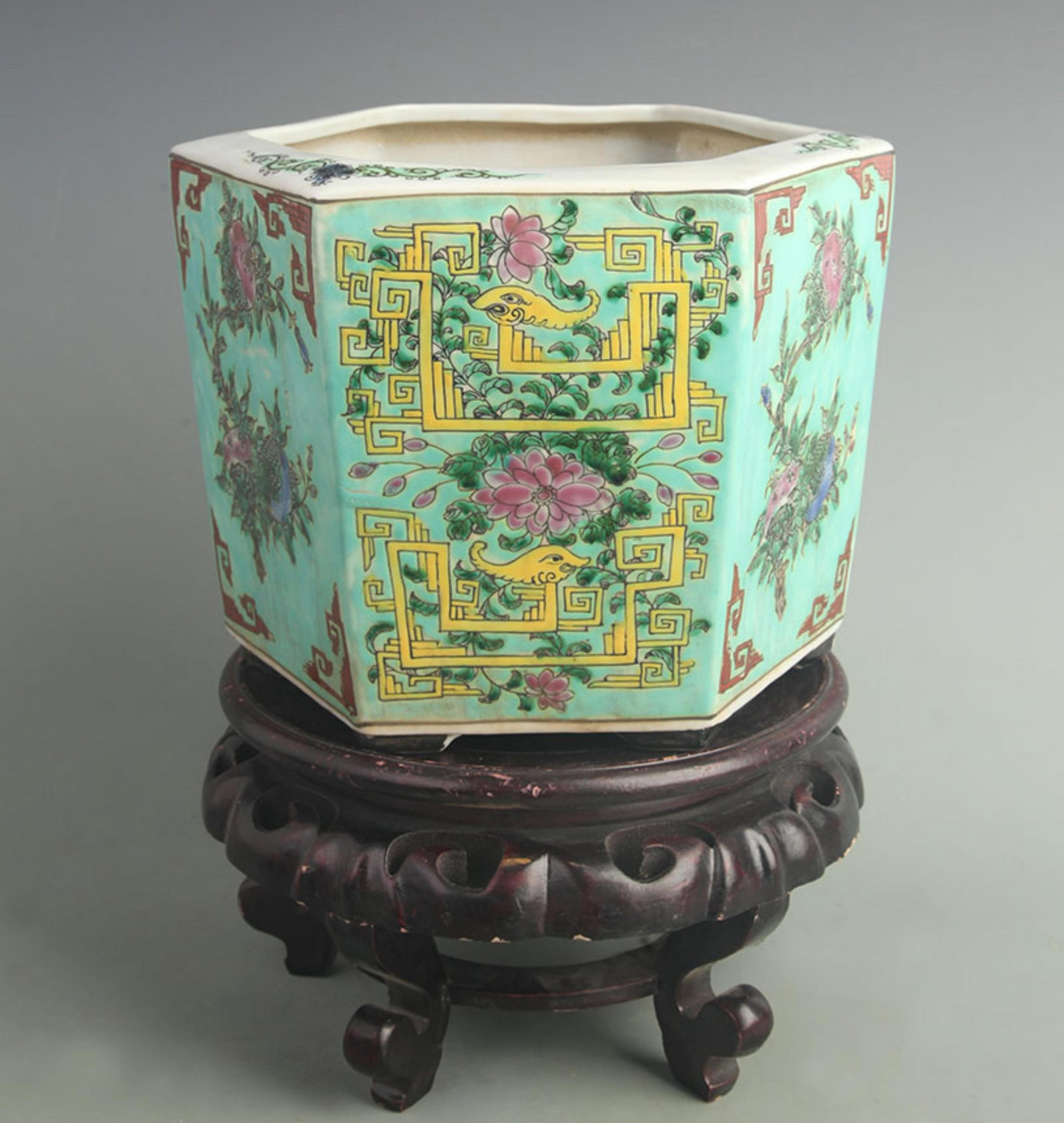 A GREEN GLAZED FAMILLE ROSE SIX SIDE FLOWER POT: Qing Dynasty; High: 6.80 inch; Diameter: 9.80 inch; Woodbase for picture and display only