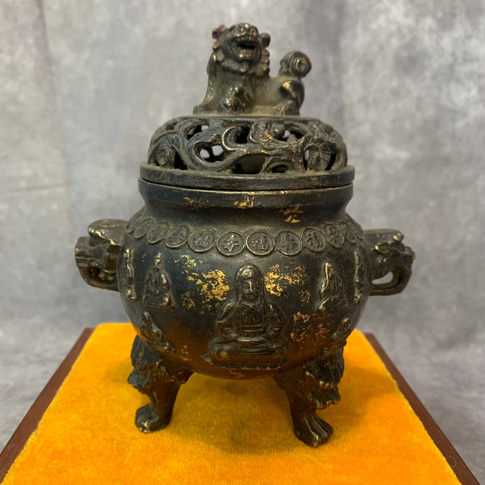 A FINE ELEPHANT EAR AND FOO DOG TOP BRONZE INCENSE CENSER: Qing Dynasty; High: 5.6 inch; Diameter: 3.7 inch; Woodbase for picture and display only