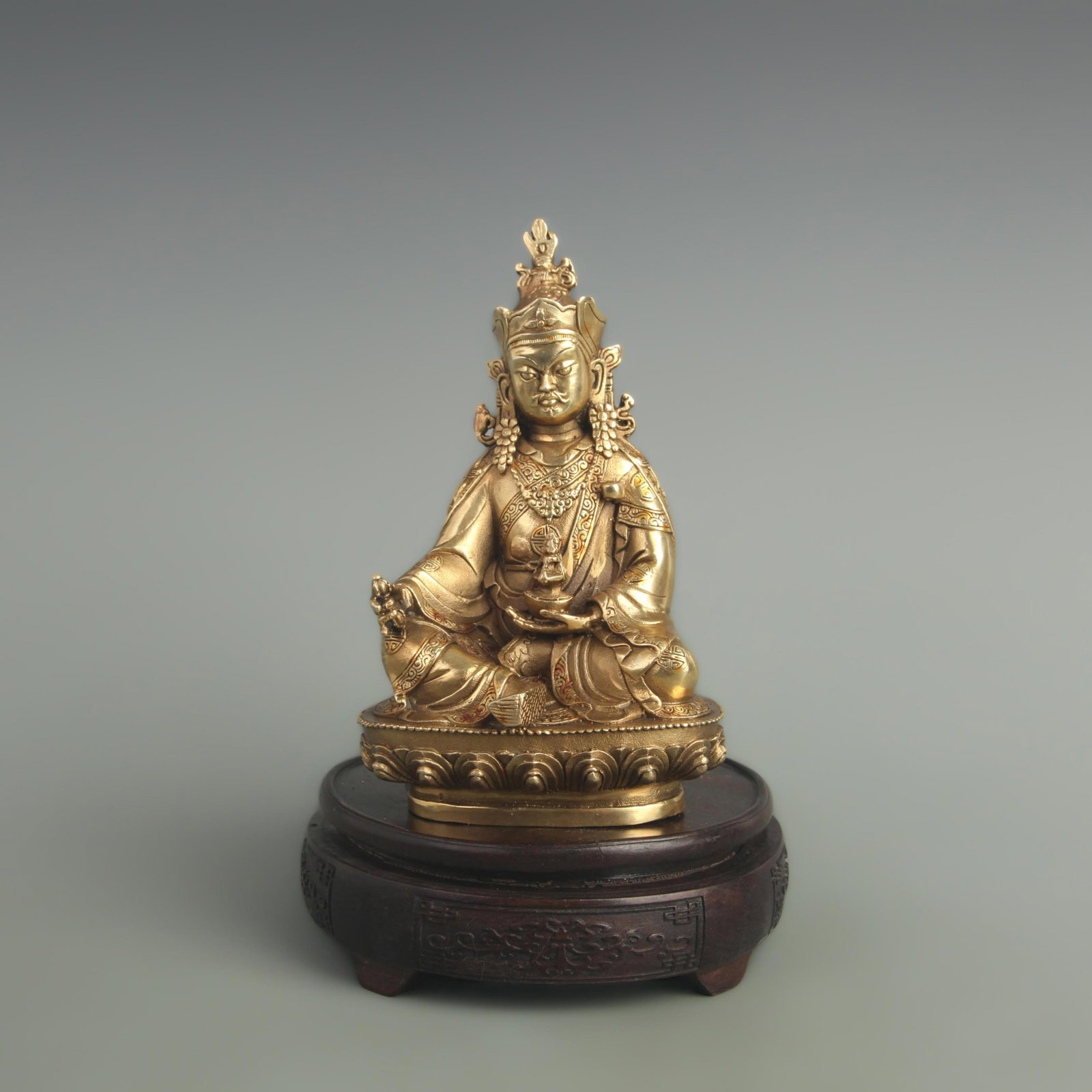 A FINE GILT BRONZE GOD OF WEALTH: 20th Century, High: 6.50 inch; Width: 2.00 inch; Long: 3.00 inch; Woodbase for picture and display only