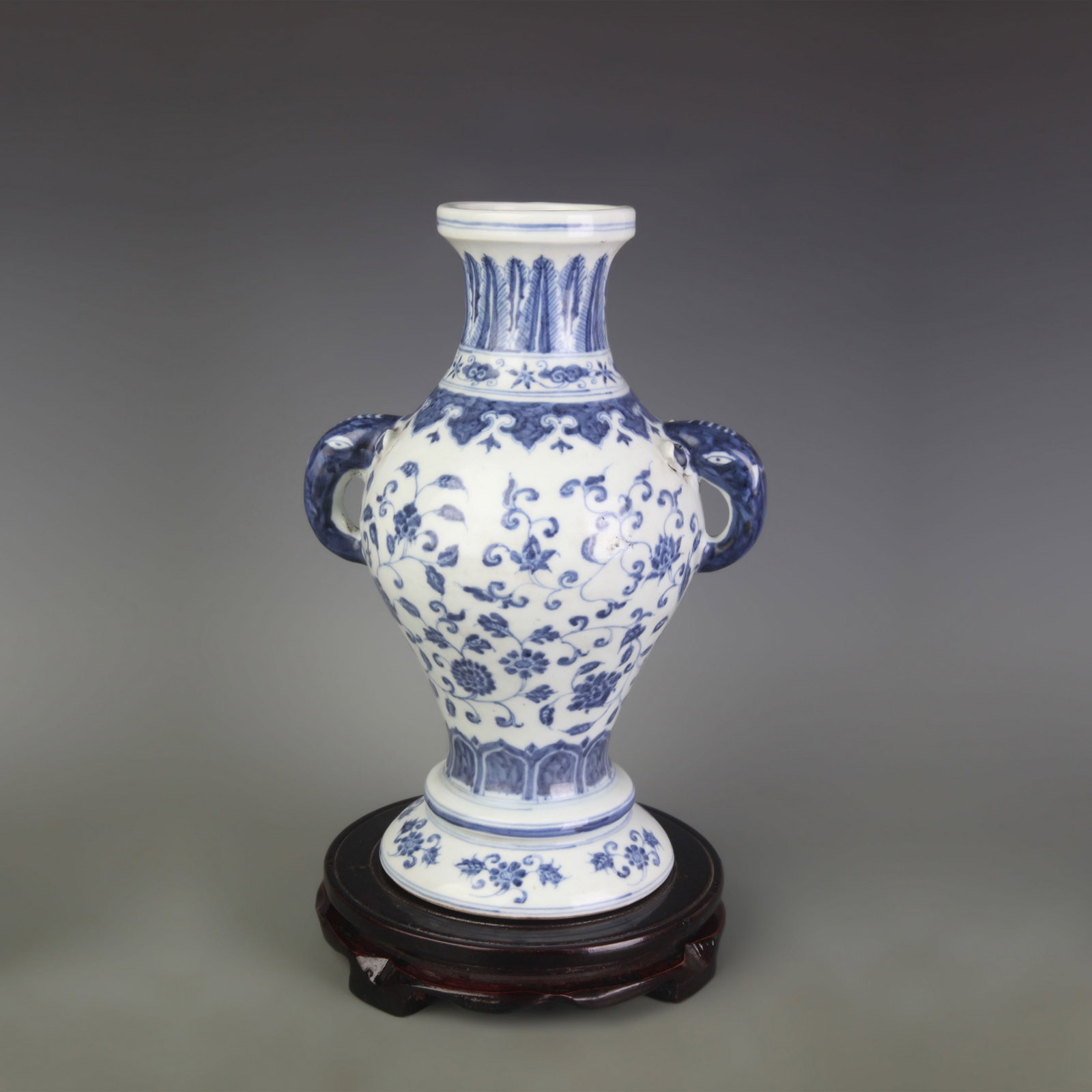 BLUE AND WHITE FLORAL PATTERN ELEPHANT-EAR STYLE PORCELAIN VASE: Ming Dynasty Style Xuan De Period: Diameter: 5.0 inch; High: 10.8 inch; Woodbase for picture and display only