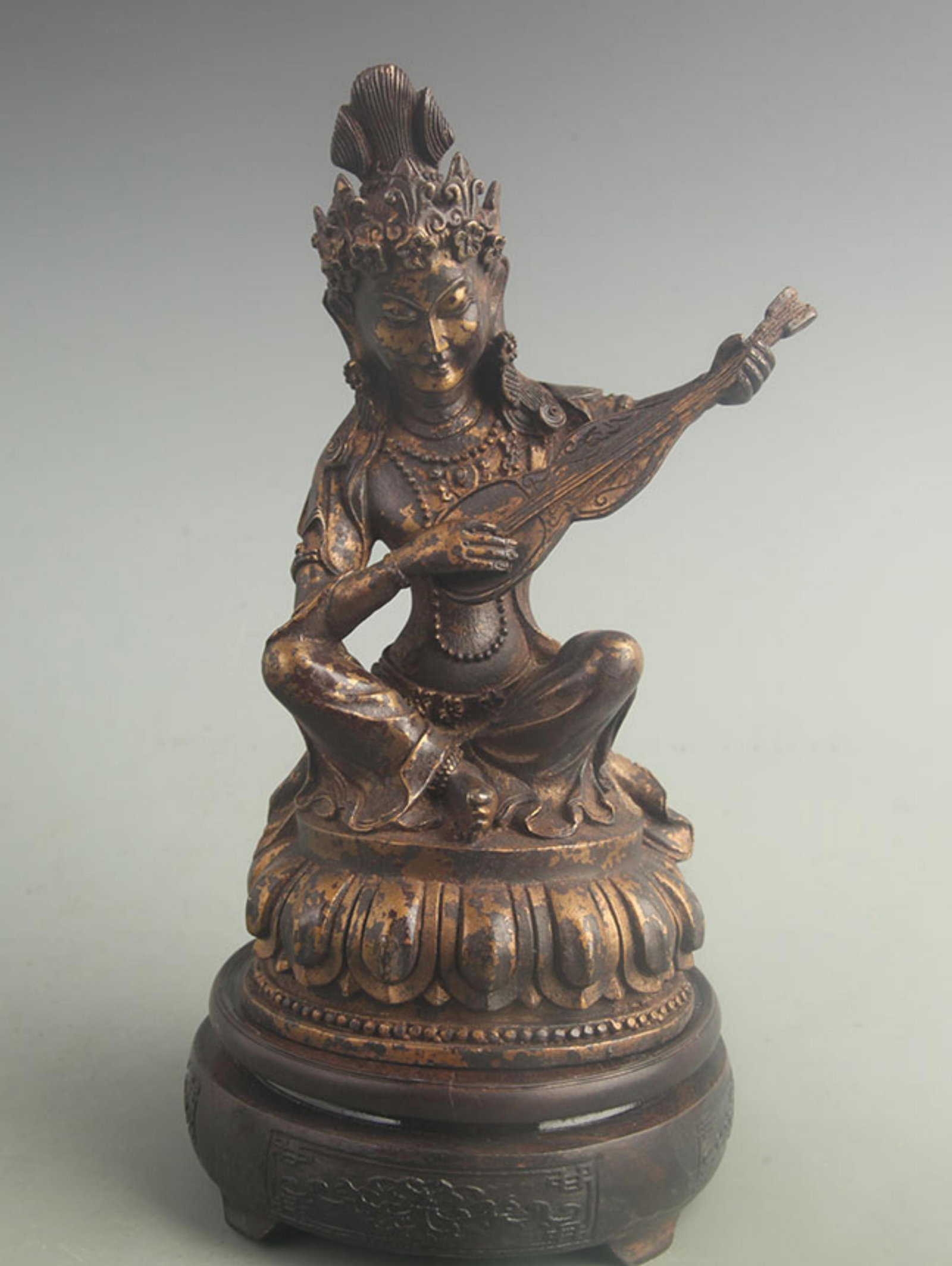 GILT BRONZE TIBETAN PROTECTOR DEITY: 19th Century; High: 9.00 inch; Width: 3.80 inch; Long: 4.50 inch; Woodbase for picture and display only